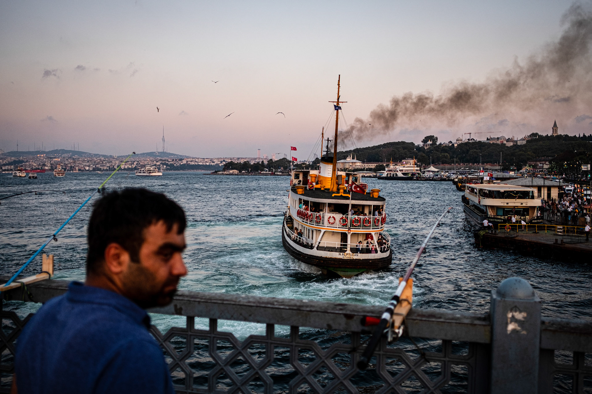 Istanbul, Turkey - 04 September 2019 : Fisherman at Galata Bridge