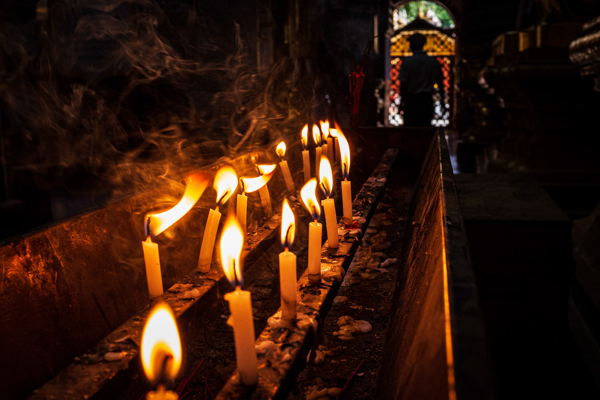 Monywa, Myanmar - 24 September 2016: Burning candles inside Thanboddhay Paya main temple