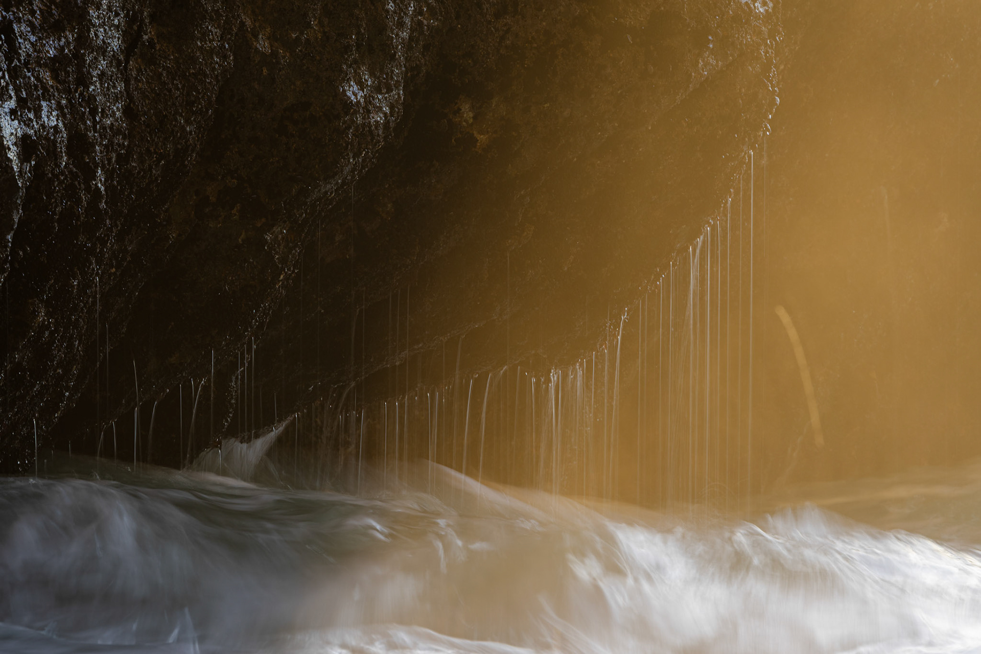 Sintra Cascais Natural Park, Portugal - 28 December 2024 : Sea water dripping off a rock