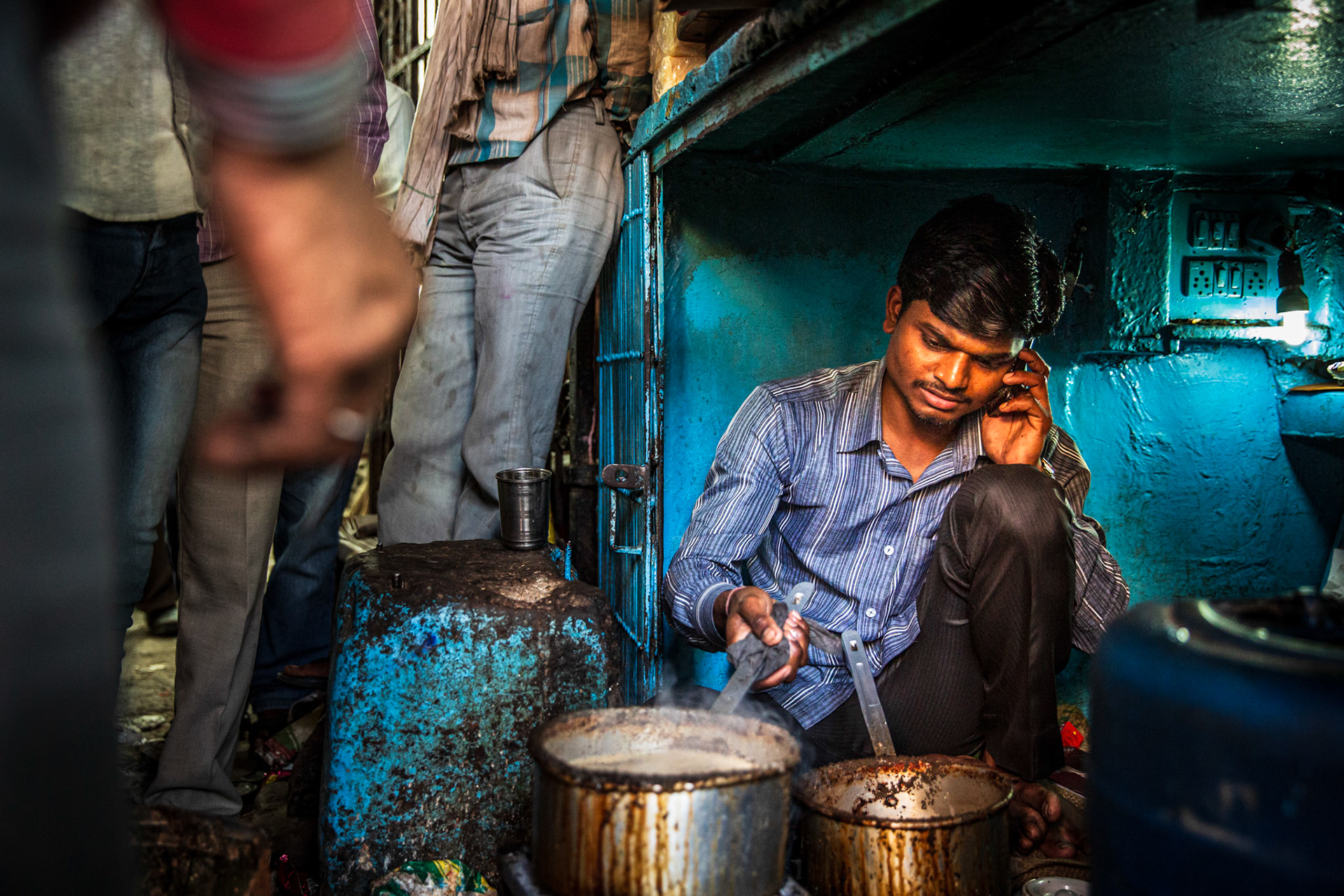 Man making chai in the streets of New Delhi. India