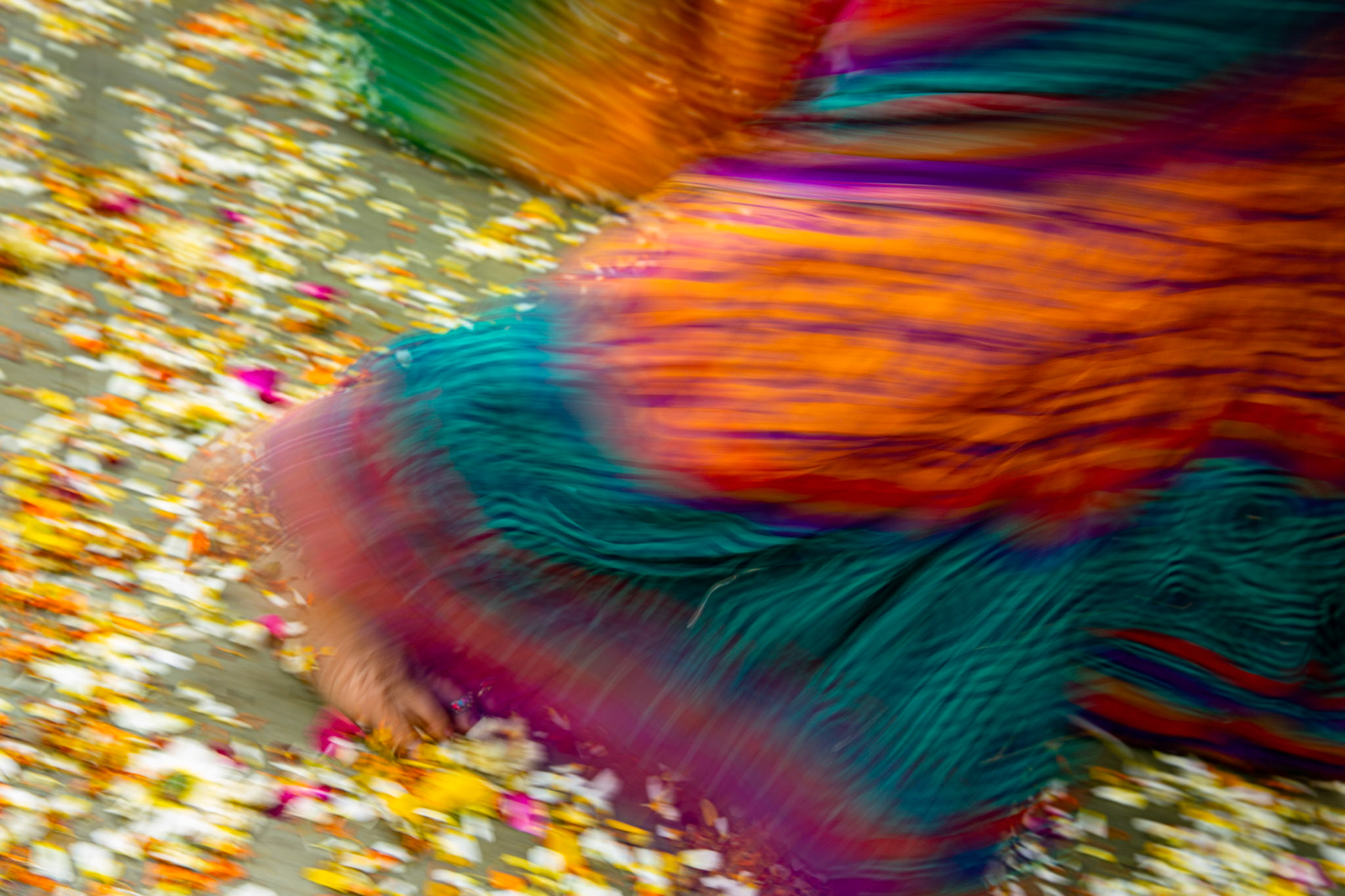 Woman dancing during the Holi festival in a village close to Mathura. Mathura, India