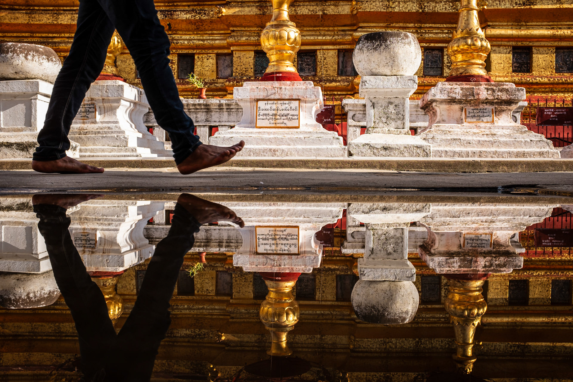 Bagan, Myanmar - 26 September 2016: Walking barefoot at Shwezigon Pagoda