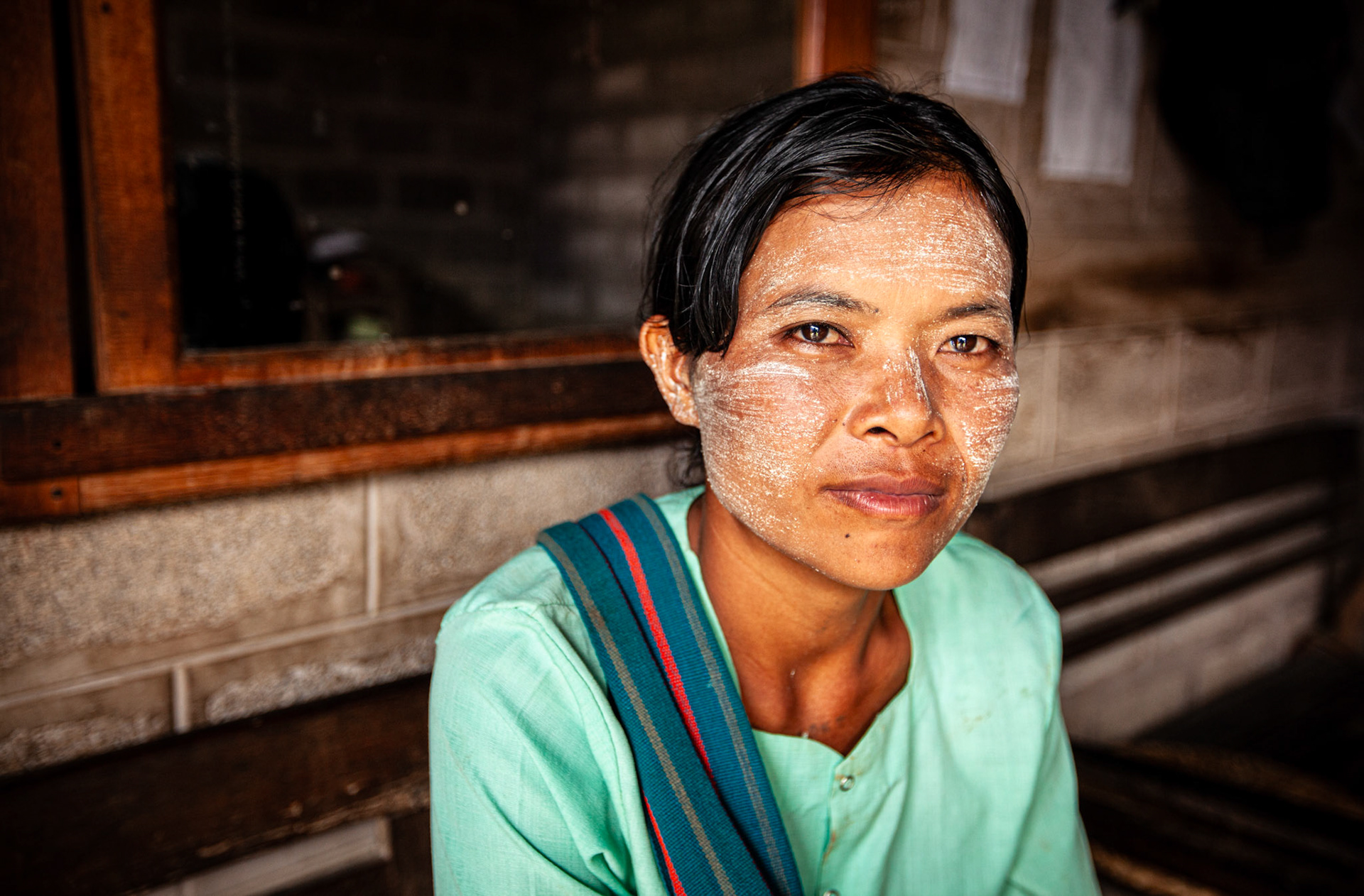 Burmese woman with thanaka on the face. Nyaung Shwe, Myanmar