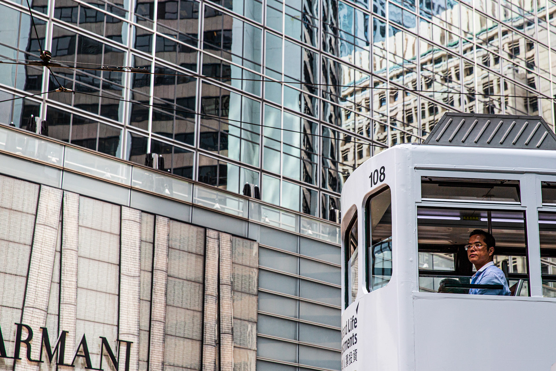 Man inside a Ding Ding in Hong Kong Central