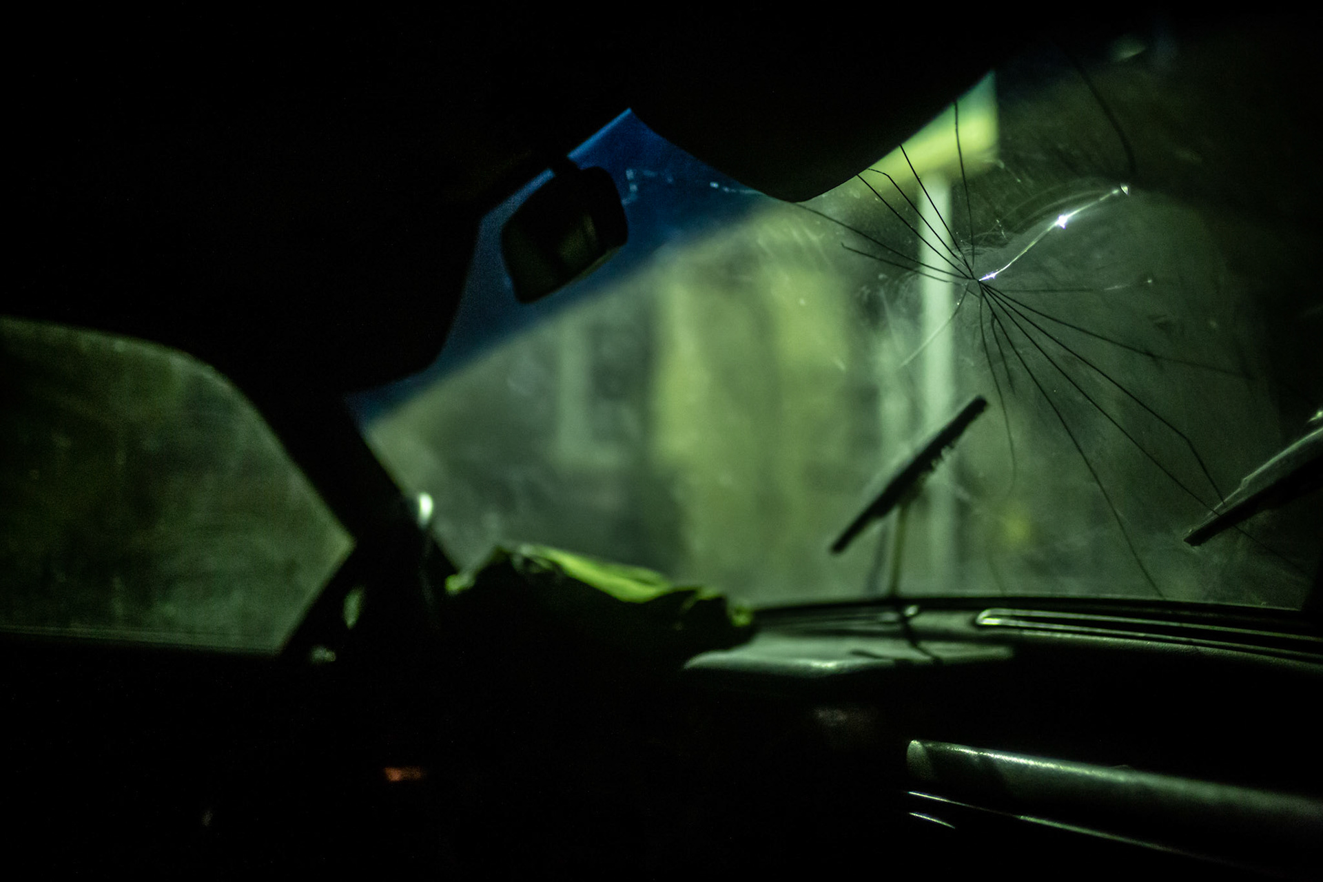 Cracked windshield of an abandoned Volga in the streets of Gyumri. Armenia