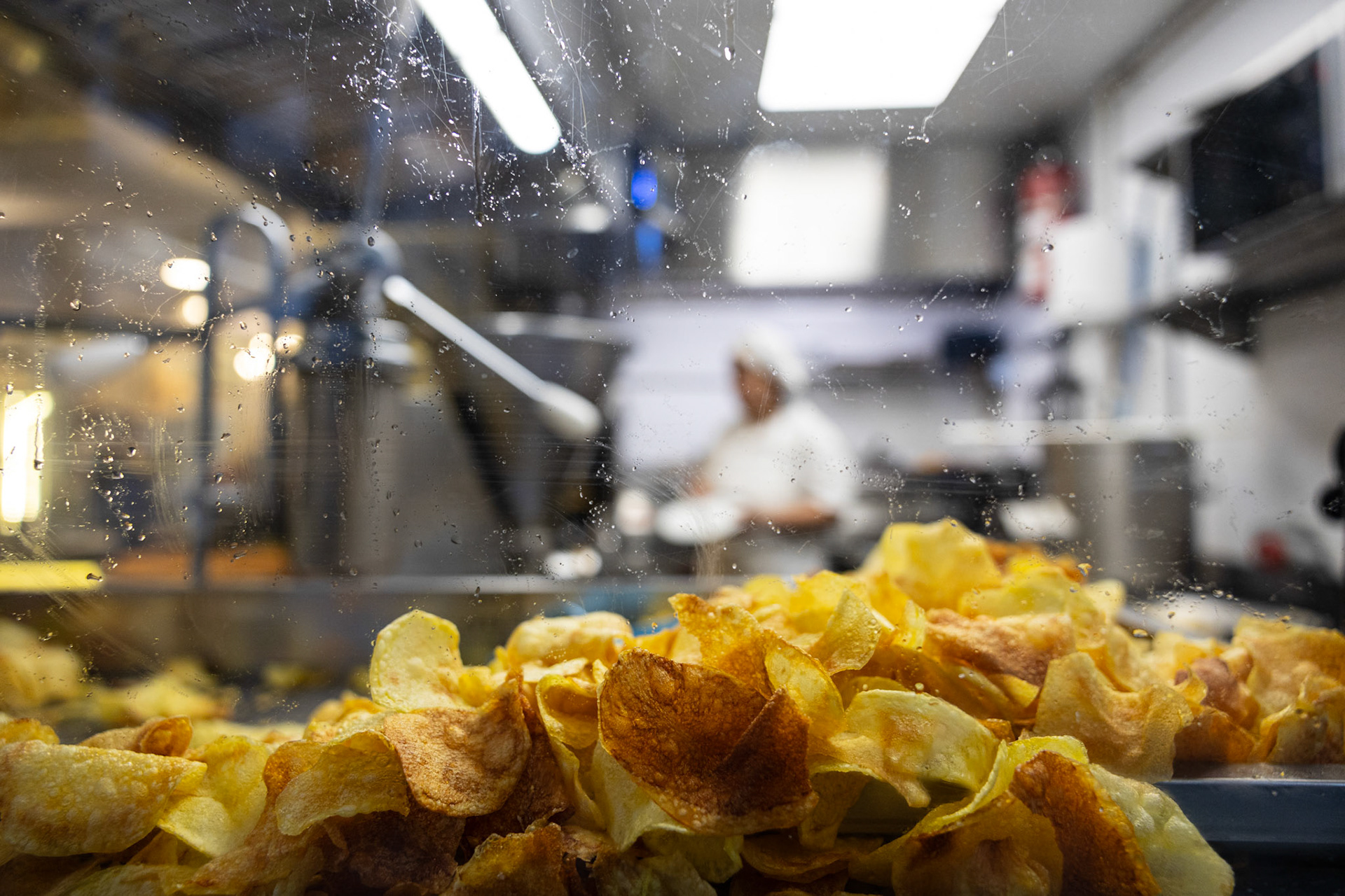 Madrid, Spain - 14 May 2023 : Potato chips by a restaurant window