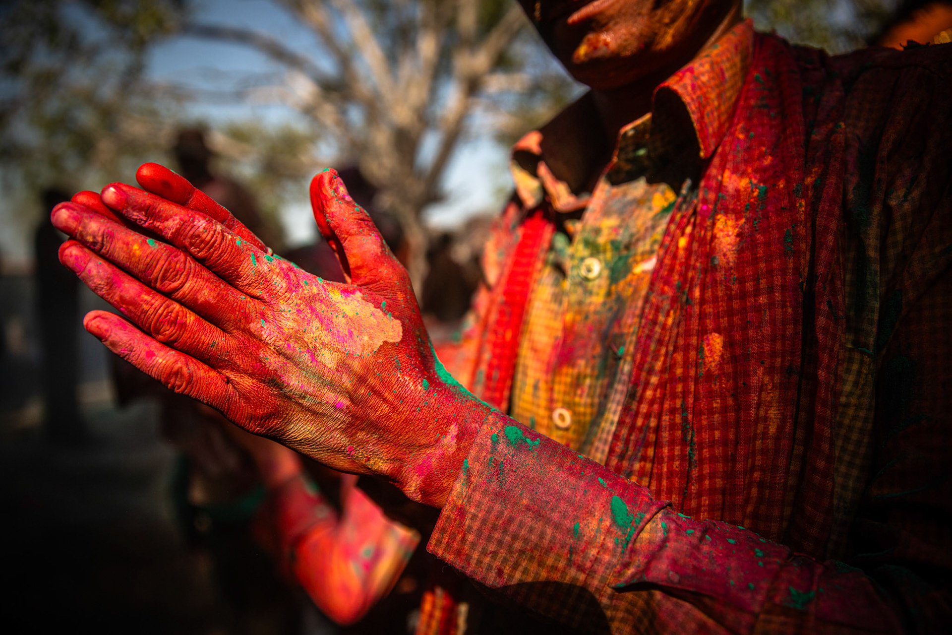 Man praying during Holi. Mathura, India