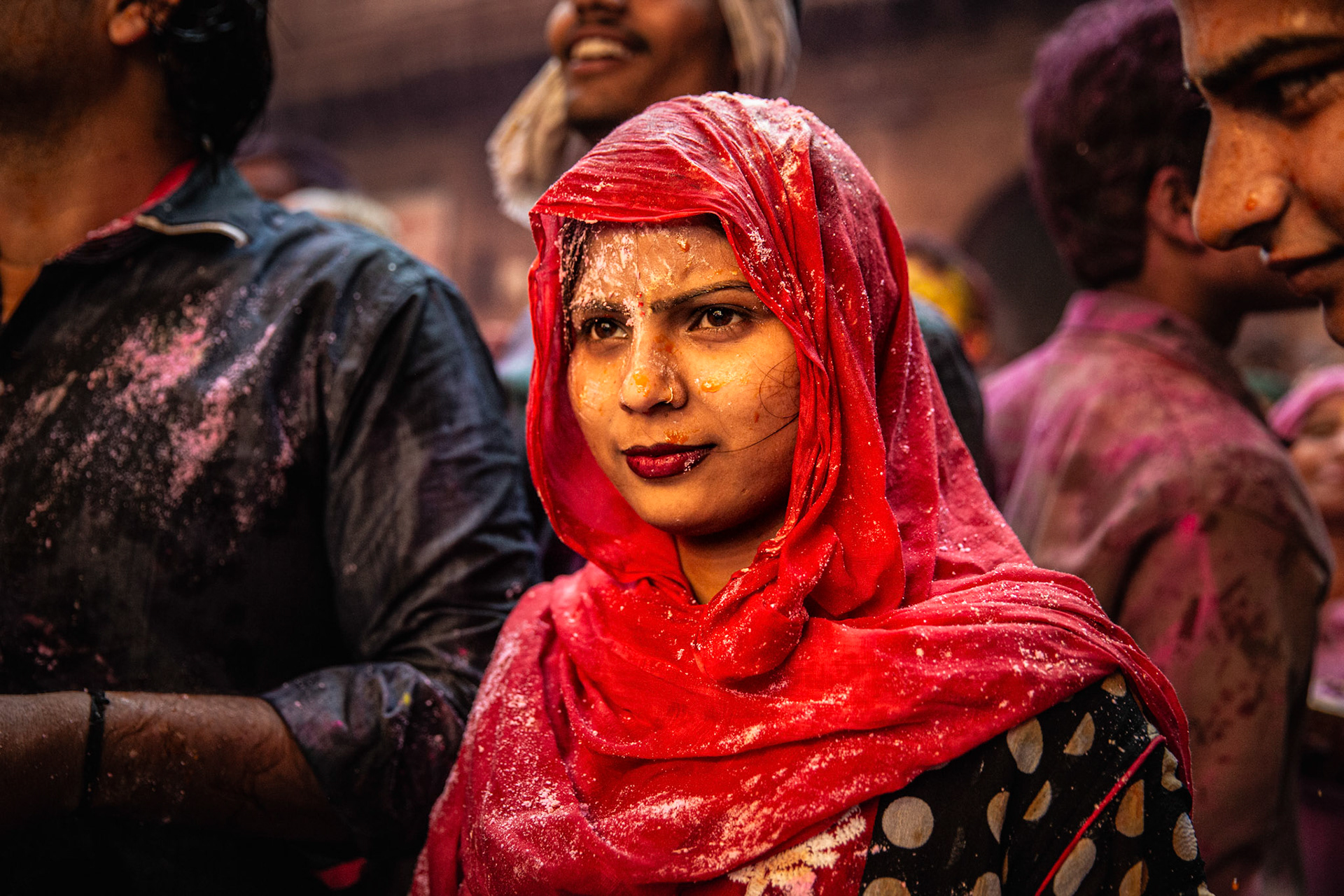 Woman attending Holi celebrations inside Bankey Bihari temple Vrindavan, India