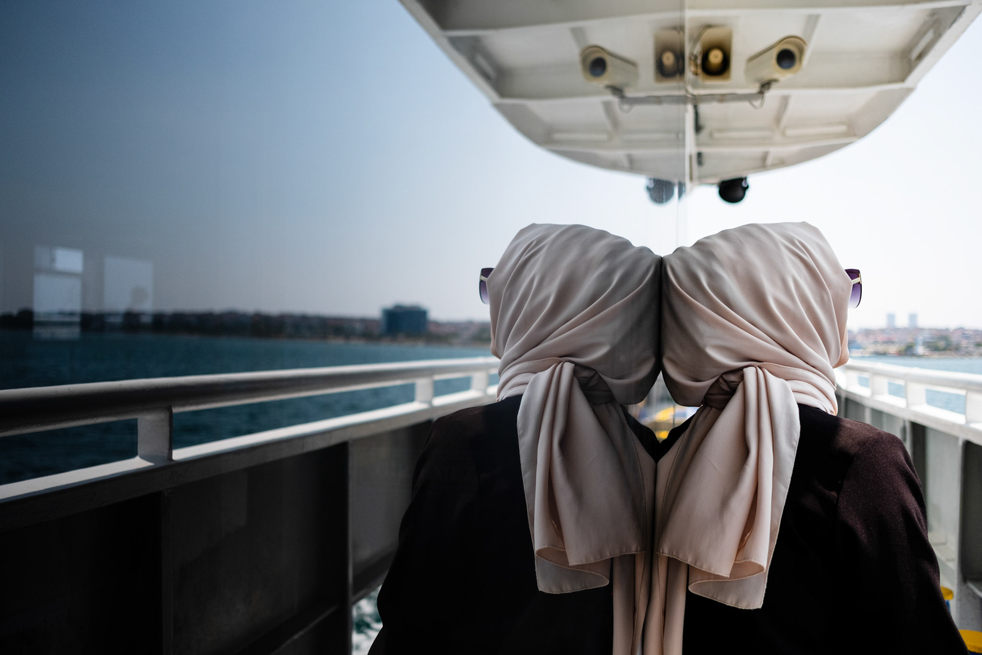 Istanbul, Turkey - 03 September 2019 : Woman with hijab travelling in a ferry across the Bosphorus