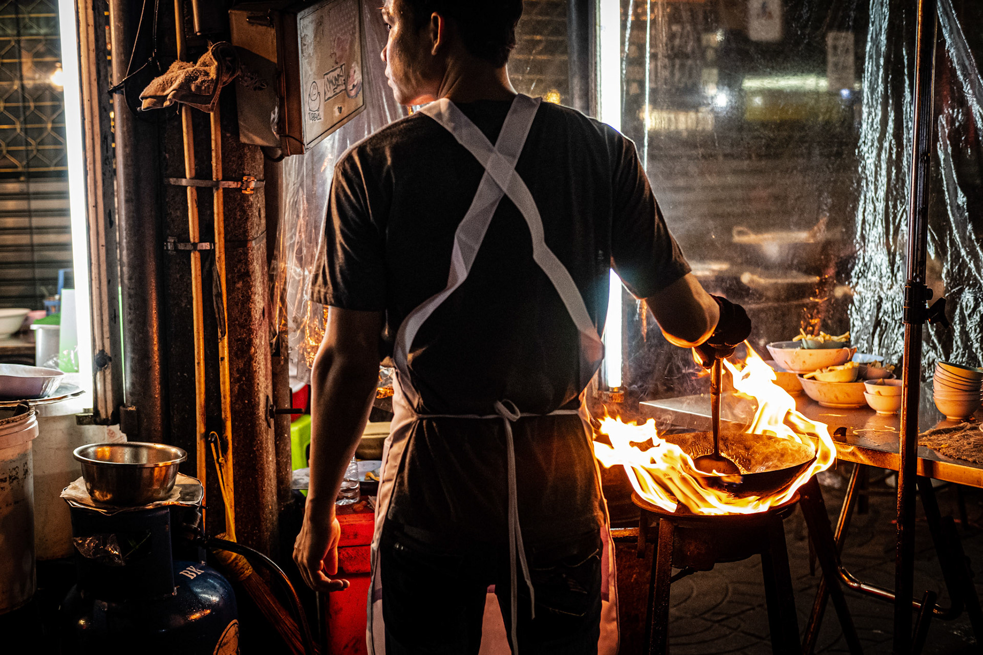 Bangkok, Thailand - 02 September 2018: Cooking with a wok at Bangkok's Chinatown