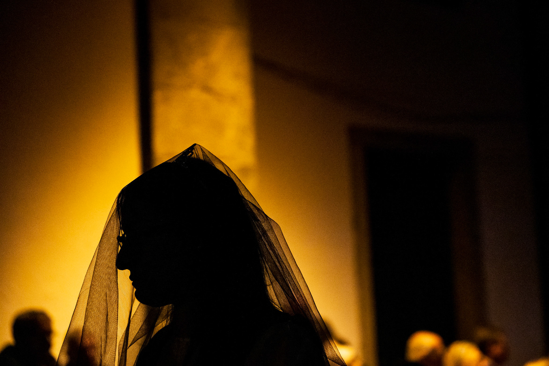 Braga, Portugal - 07 April 2023 : Woman in veil at Lord's Burial Procession