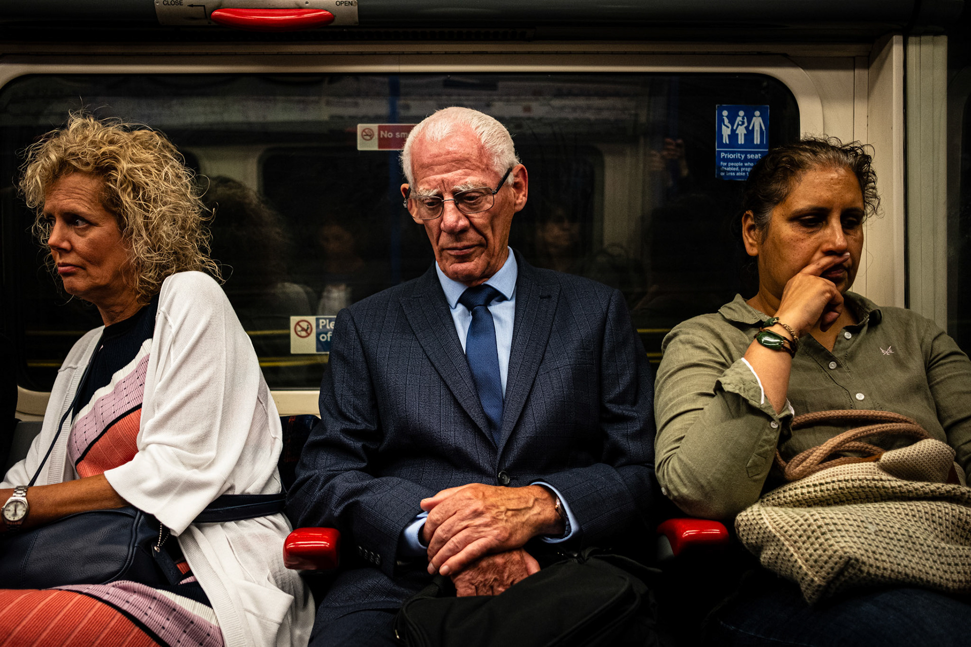 London, England - 12 June 2018: People traveling in London metro