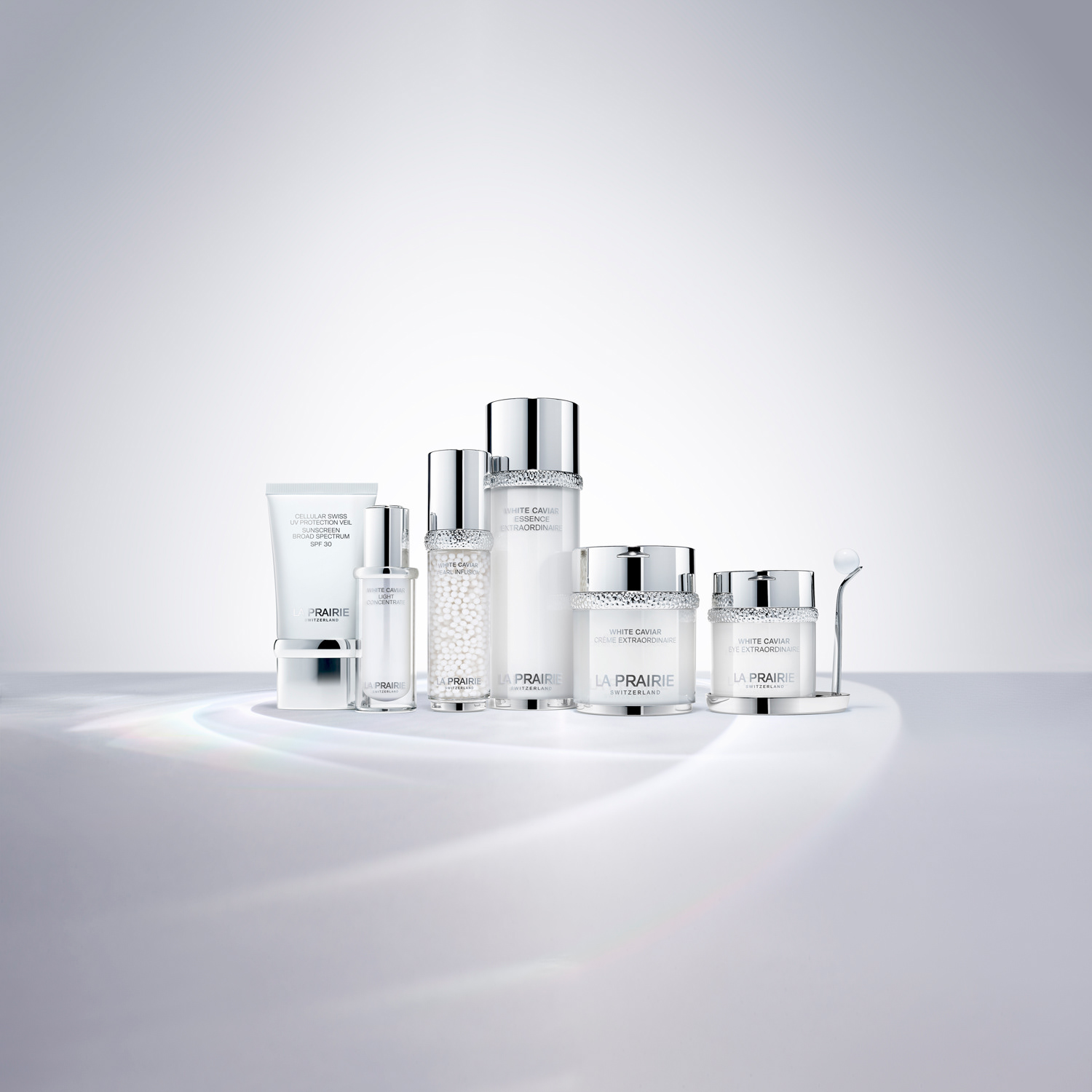 Still life photo La Prairie Cosmetics, White caviar range, on white background with caustics