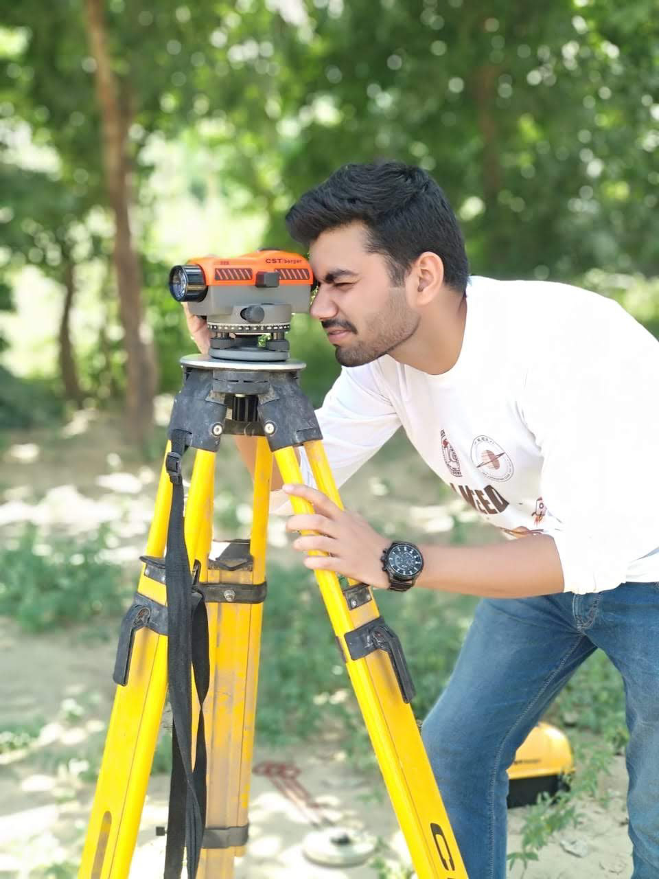 Me, also a Civil Engineer, using theodolite for measuring land levels.