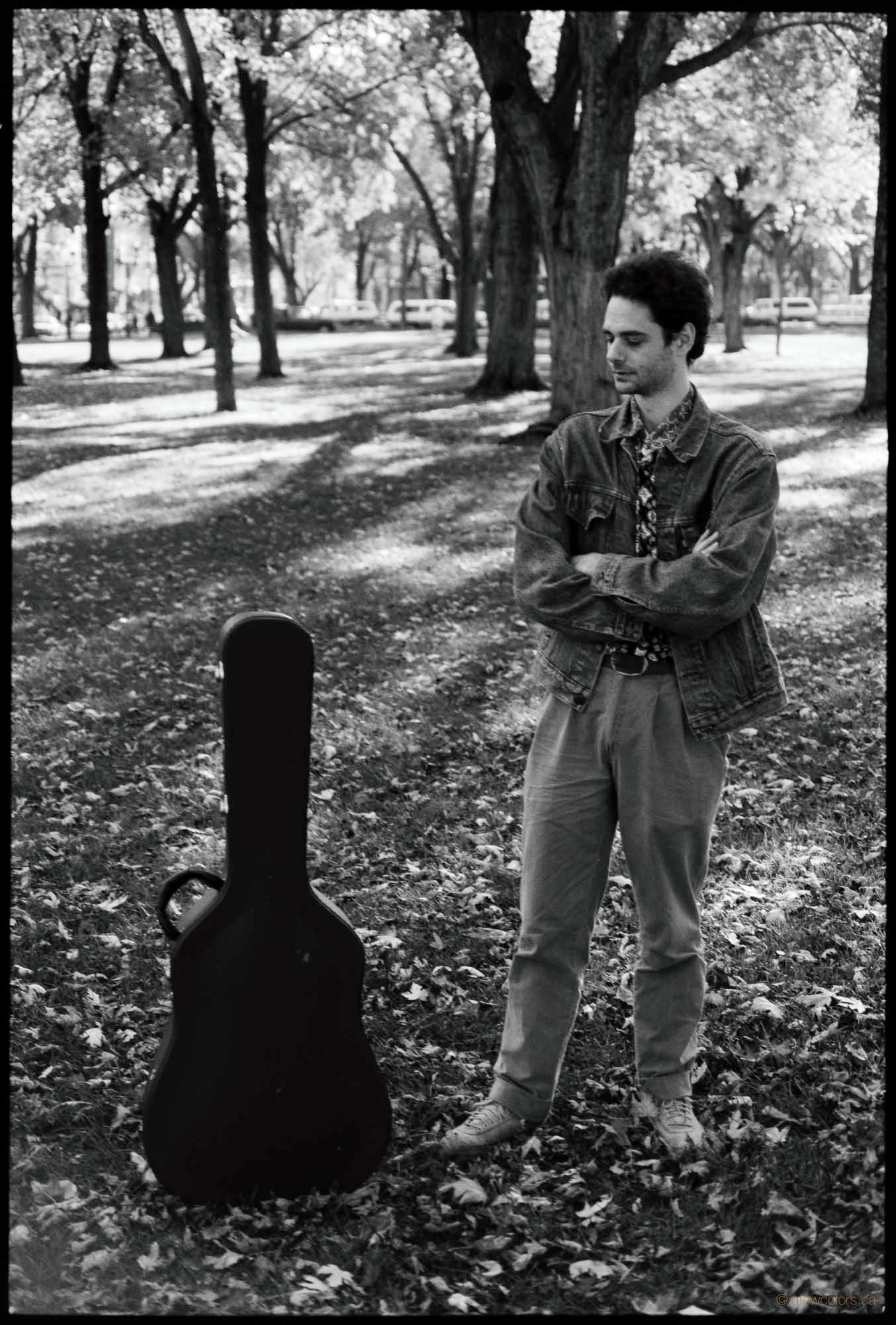 Luc Bourgeois looking at his guitar case