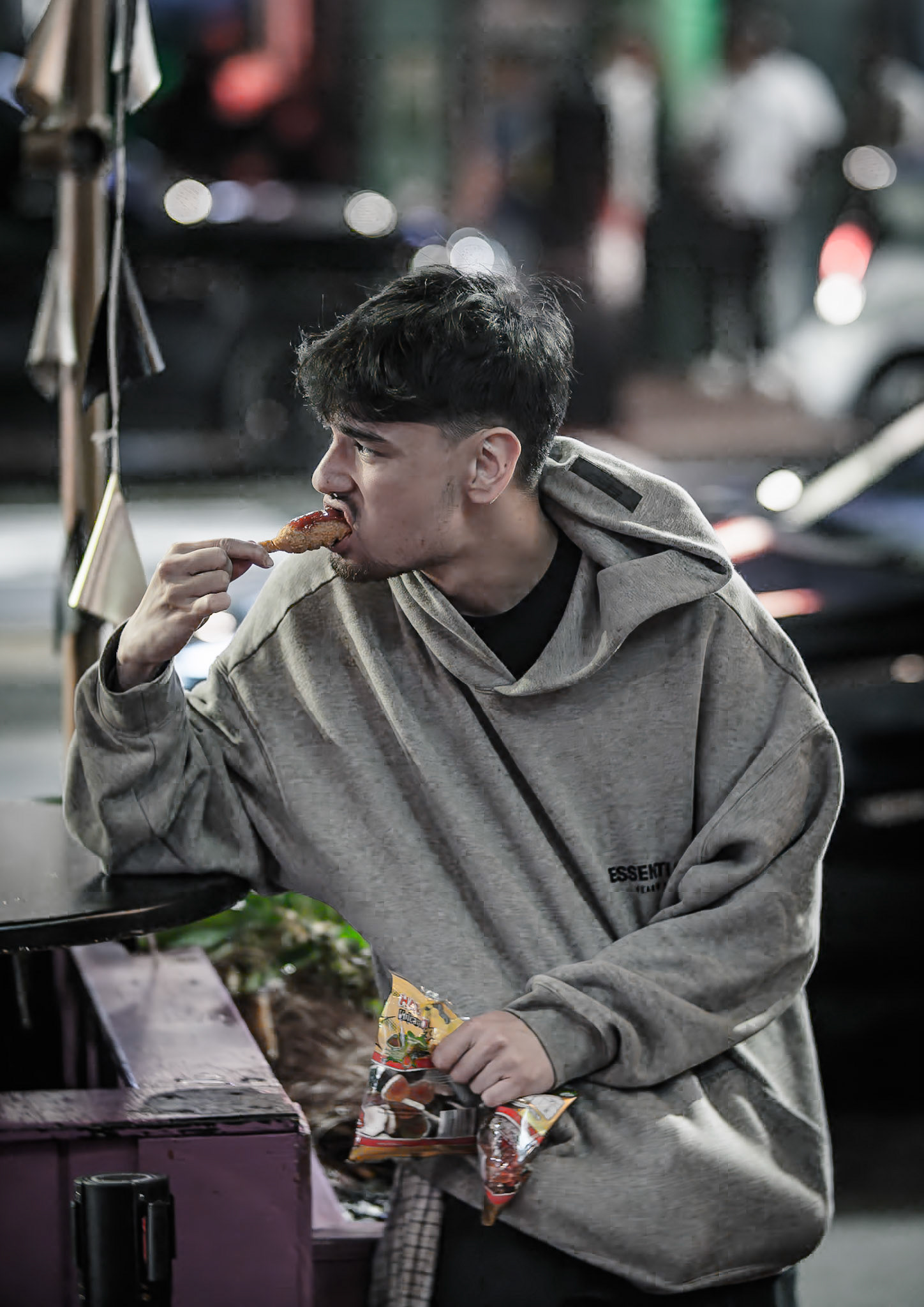 Unknown man enjoying drunk food outside Shady Lady Bar on Courtney Place