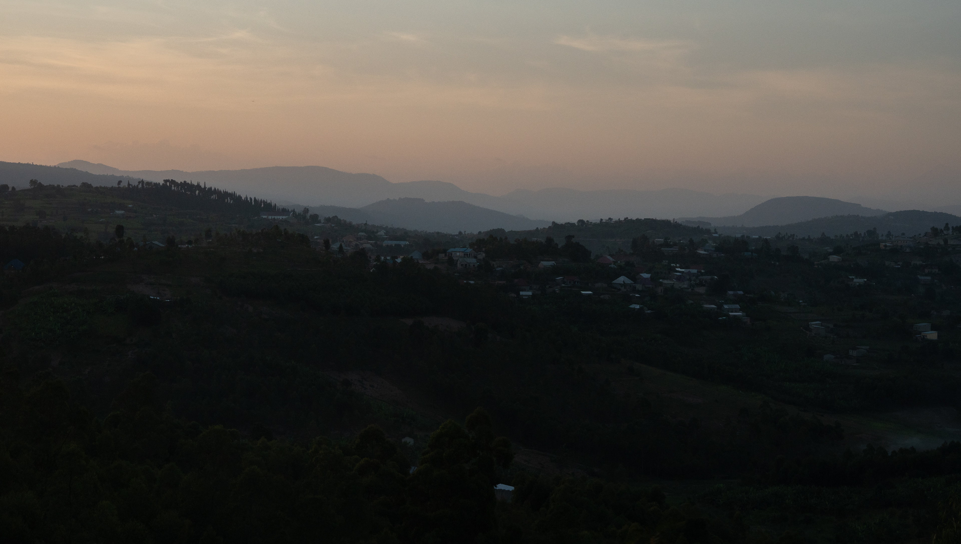 The hilly countryside at sunset on Sunday, May 24, 2026 in Rwanda.   Rwanda is known as the land of a thousand hills for its mountainous, hilly topography. Kigali’s average altitude is over 5,000 feet above sea level, and the nation’s highest point is atop Mount Karisimbi at 14,787 feet.   Rwanda is just below the equator, but the altitude keeps temperatures between around 60-80 degrees Fahrenheit. The landscape is often tropical.  (Photo/Evan Frilingos 2026)