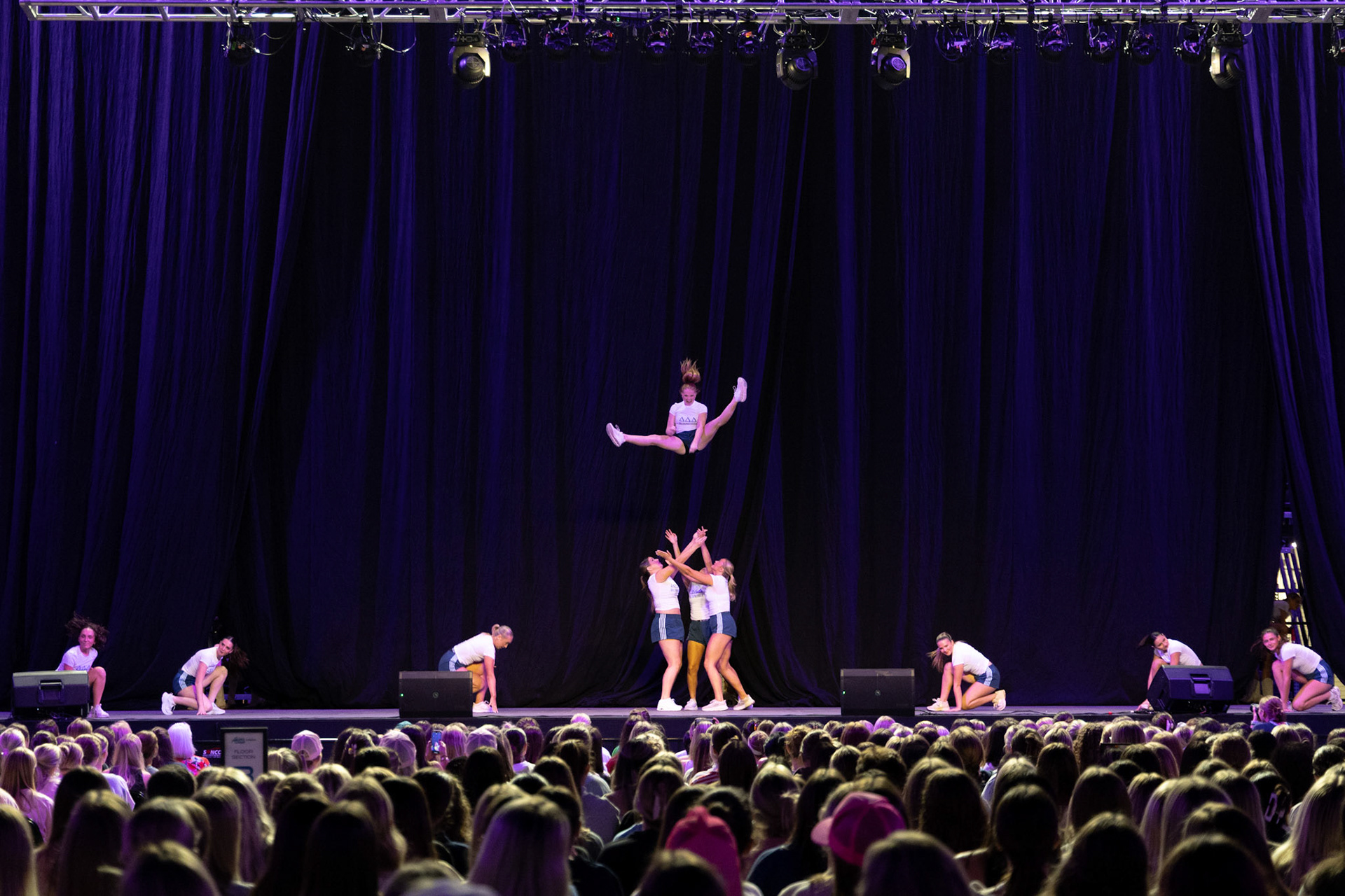 Members from Delta Delta Delta perform at the 21st annual Greek Grind at Akins Ford Arena in Athens, Georgia on Wednesday, Oct. 15, 2025. The event raises money Sigma Delta Tau’s national philanthropy, Prevent Child Abuse America, and is UGA’s largest Panhellenic philanthropy event, according to the event program. (Photo/Evan Frilingos; @frilingos.photos)