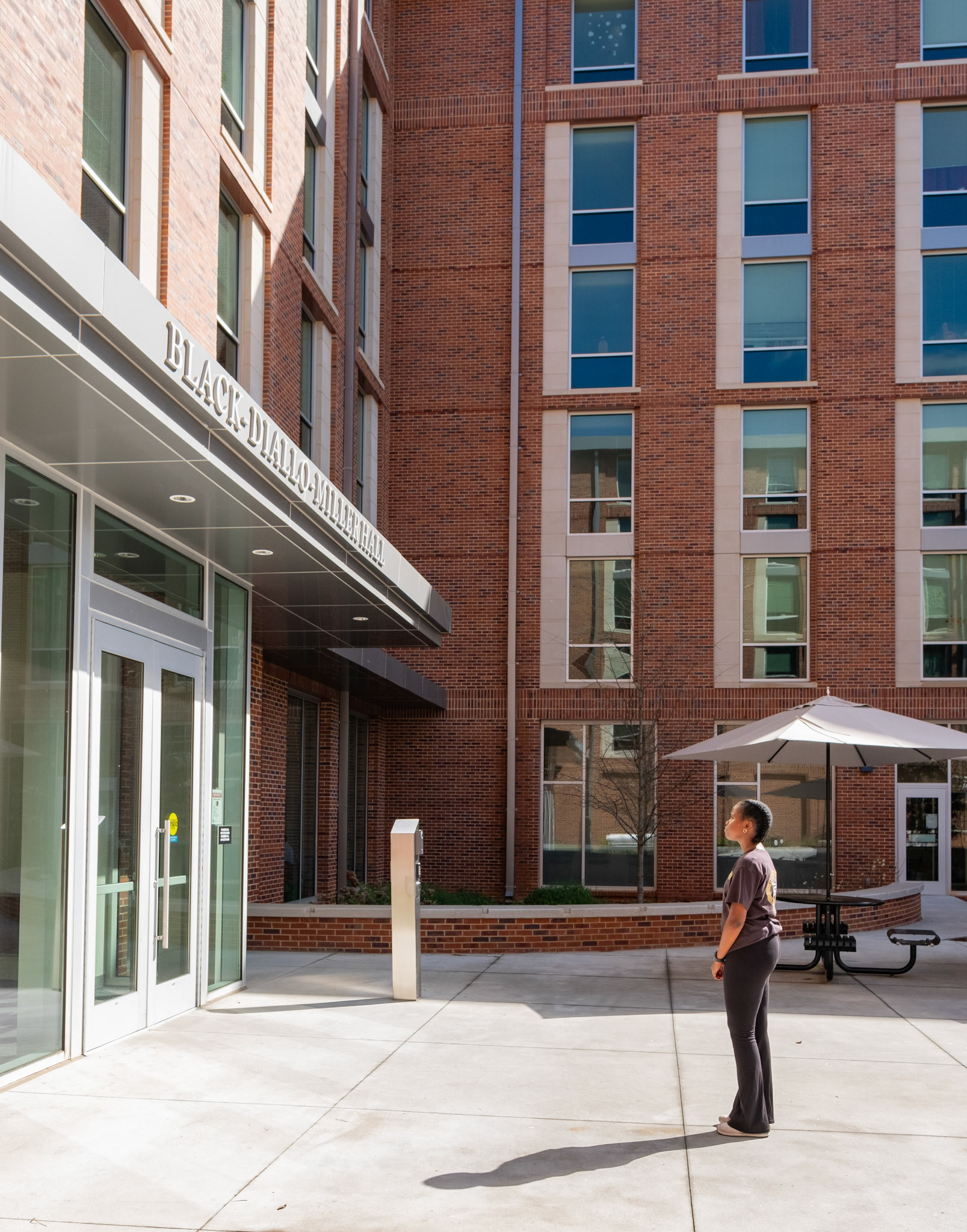 A University of Georgia freshman poses in front of Black Diallo Miller Hall in Athens, Georgia on Saturday, March 23, 2024. (Photo/Evan Frilingos; @frilingos.photos)