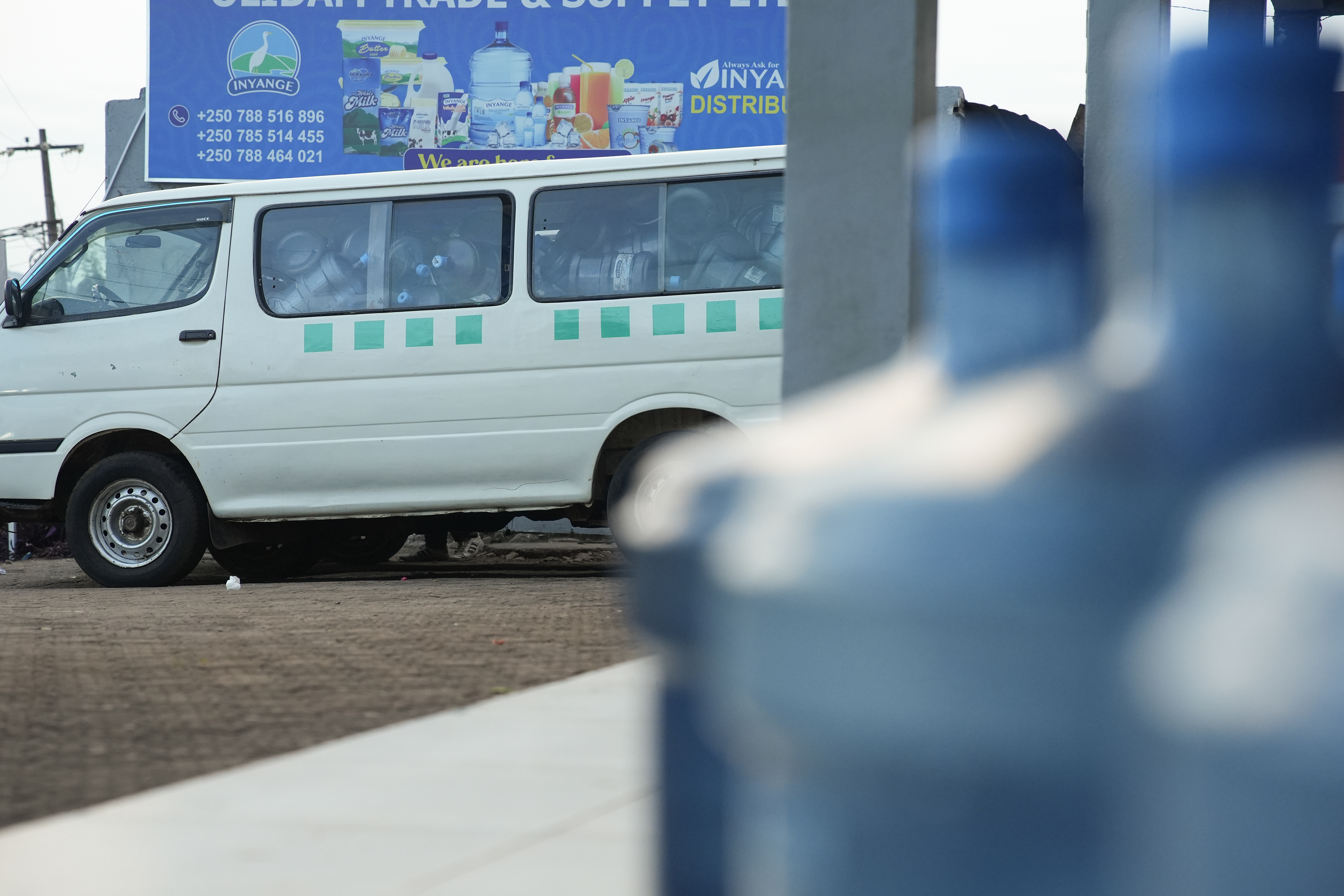 Empty plastic water jugs await recycling and fill a truck on Thursday, May 21, 2026 in Kigali, Rwanda.   Kigali is widely recognized as the cleanest city and Rwanda the cleanest country in Africa, reflecting the government’s prioritization of climate neutrality and waste management.  Plastic bags were banned in 2008 and by 2019 all single-use plastics were banned in Rwanda. The Rwanda Climate Action Plan and Vision 2050 aims to have achieved a climate-resilient, net-zero economy by 2025.   The nation ties its emphasis on cleanliness to preventing conditions that lead to the violence, hate and division seen during the genocide. A wall at the Kigali Genocide Memorial is dedicated to explaining the negative effects of climate change and how it leads to identity-based violence. (Photo/Evan Frilingos 2026)