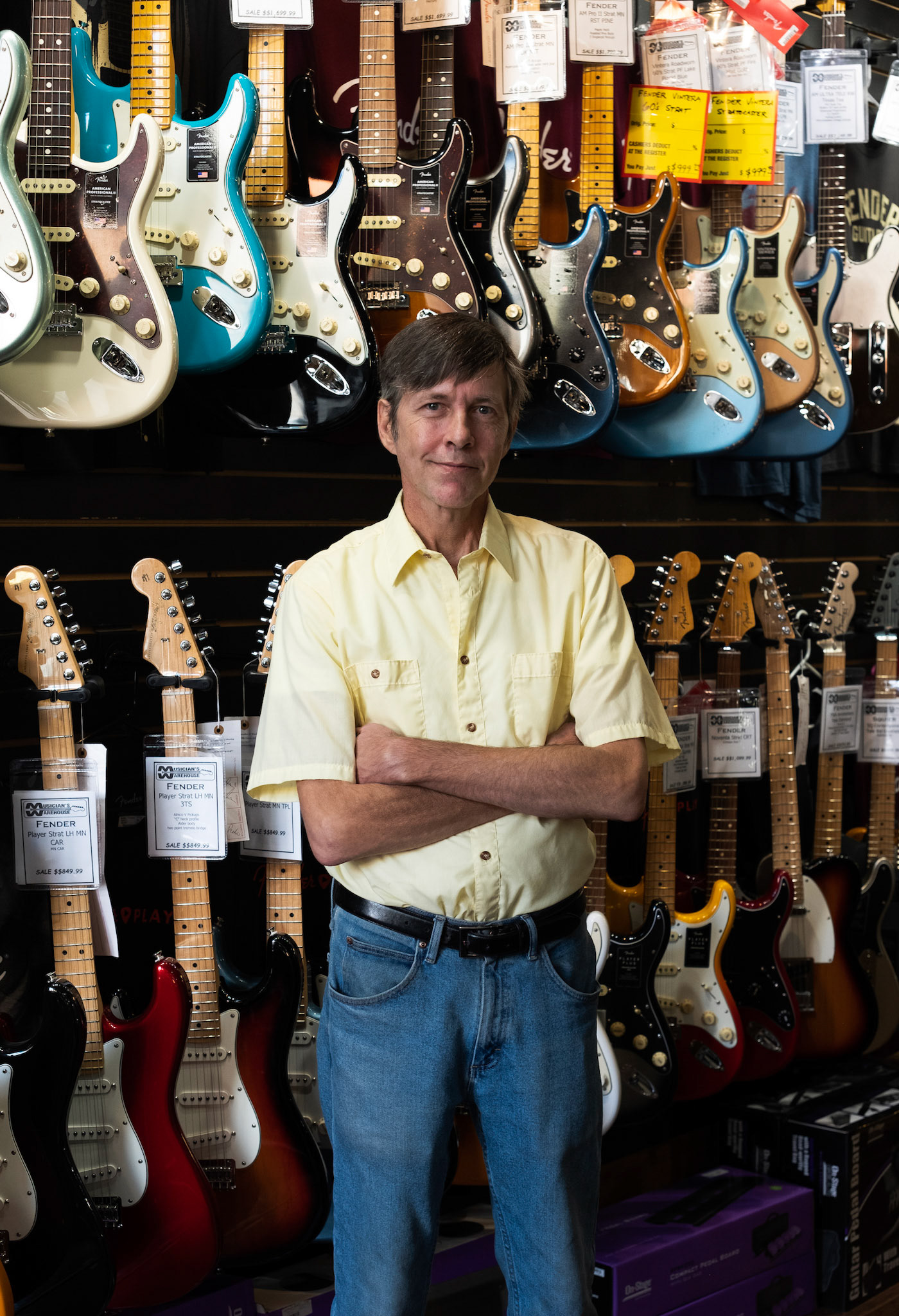 Ian Werden, manager of Musician's Warehouse in downtown Athens, poses for a photo on October 25th, 2023. Musician's Warehouse has been serving the Athens musical community for over 25 years. Werden wants aspiring musicians to know that 20 minutes of practice five times a week will yield better results than even two hours of practice once a week. (Photo/Evan Frilingos)