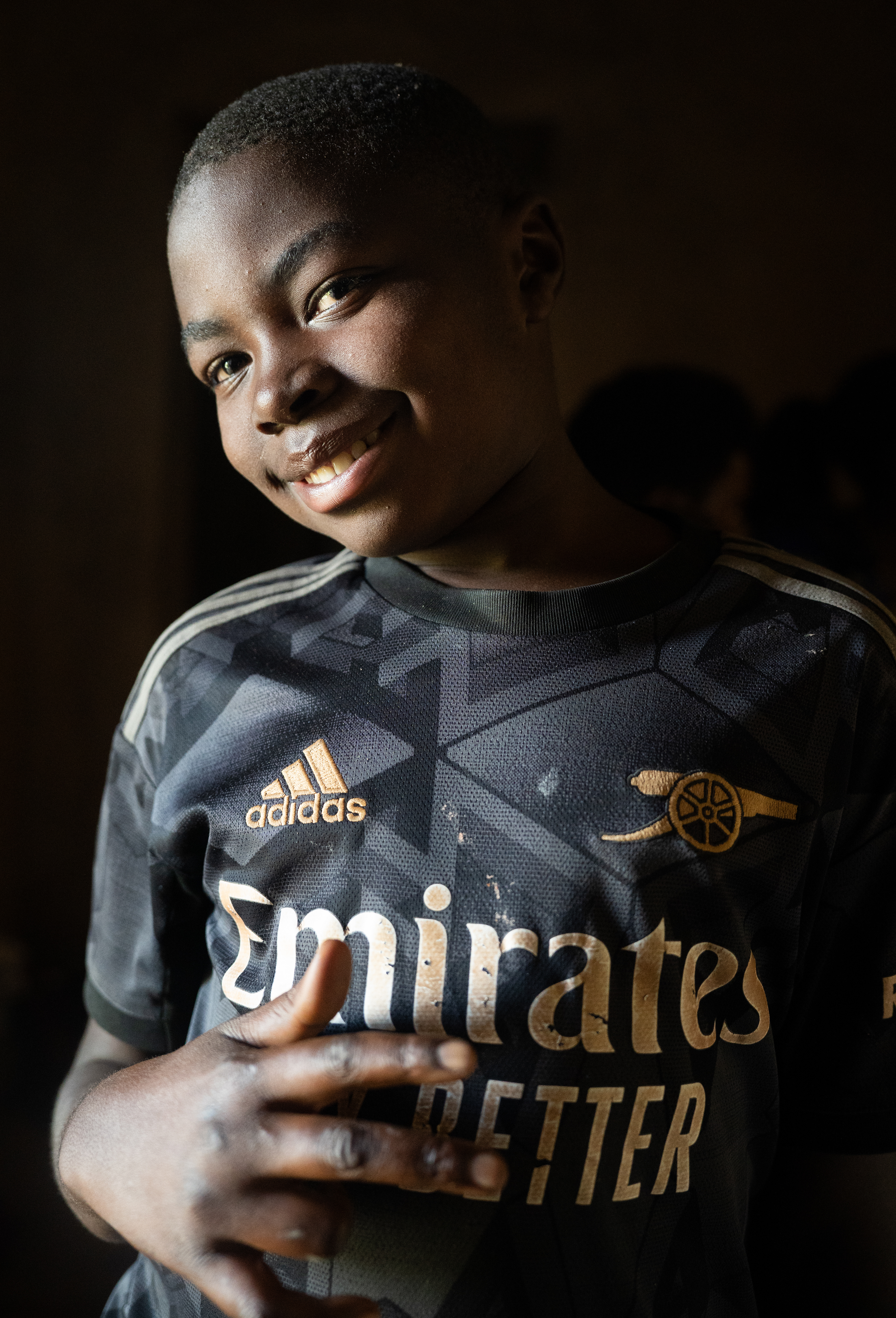 Irene wears an Arsenal jersey that features the globally-known Visit Rwanda logo on the sleeve.  Football is hugely popular for Rwandan youth, and Visit Rwanda’s sponsorship deals have inspired many to cheer for teams including Arsenal and Paris Saint-Germain.   One of Rwanda’s most promising young players, 18-year-old Barthazar Ndayshiminaye, plays for European giants FC Bayern Munich in Germany. (Photo/Evan Frilingos 2026)