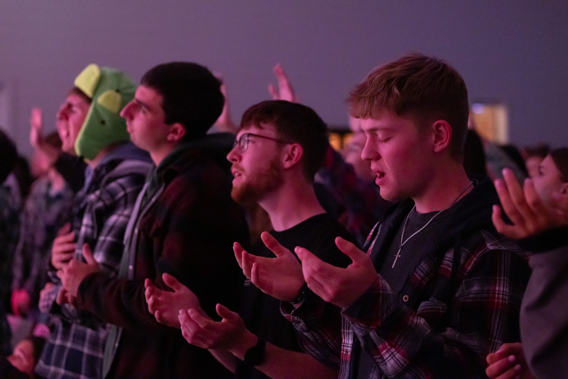Carson Candela, right, a Wesley leader, worships with other students at Wesley Chapel in Athens, Georgia on Monday, Nov. 10, 2025. Gen Z males have been increasingly attending church nationally and in Athens. (Photo/Evan Frilingos)