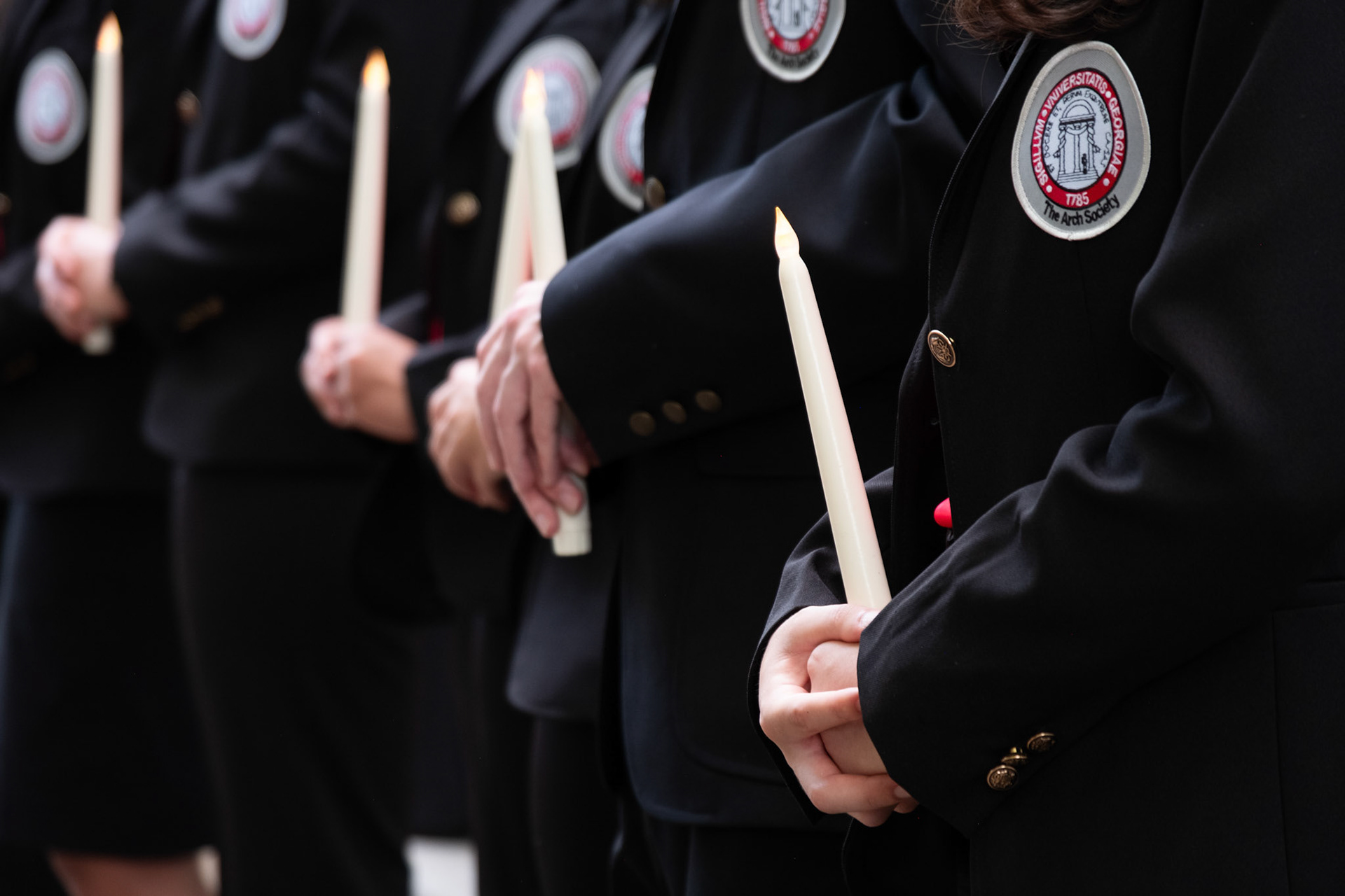 Members of the Arch Society hold candles that represent each student, faculty or staff member who died since April 2023. The annual Georgia Remembers: A Candlelight Memorial was held on Tuesday evening, April 30, 2024. (Photo/Evan Frilingos; @frilingos.photos)