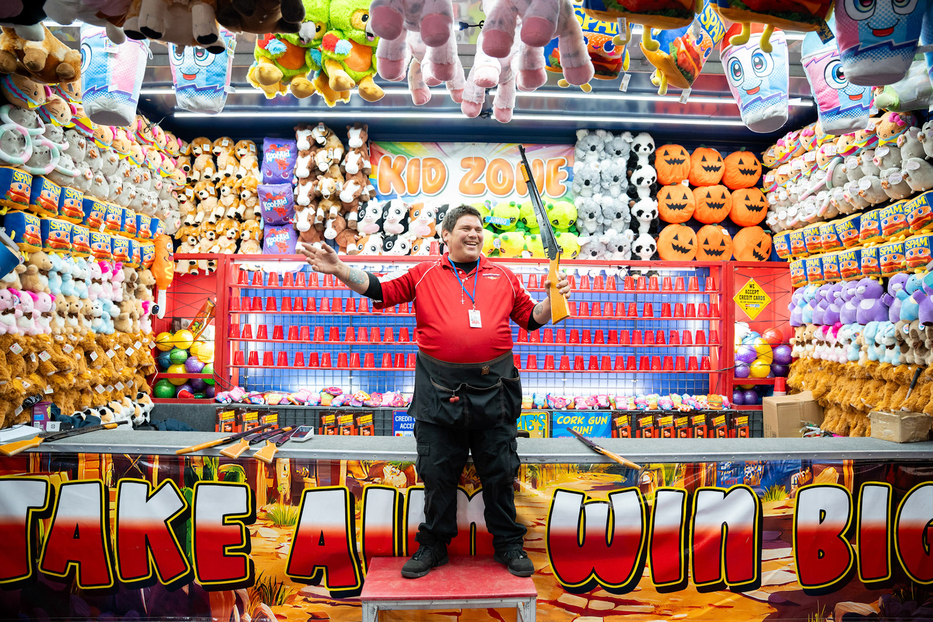 Joe Torrez, 31, a carnival salesman from Bakersfield, California, poses for a photo at the Coolray Field Carnival on Friday, March 13, 2026 in Lawrenceville, Georgia. (Photo/Evan Frilingos)