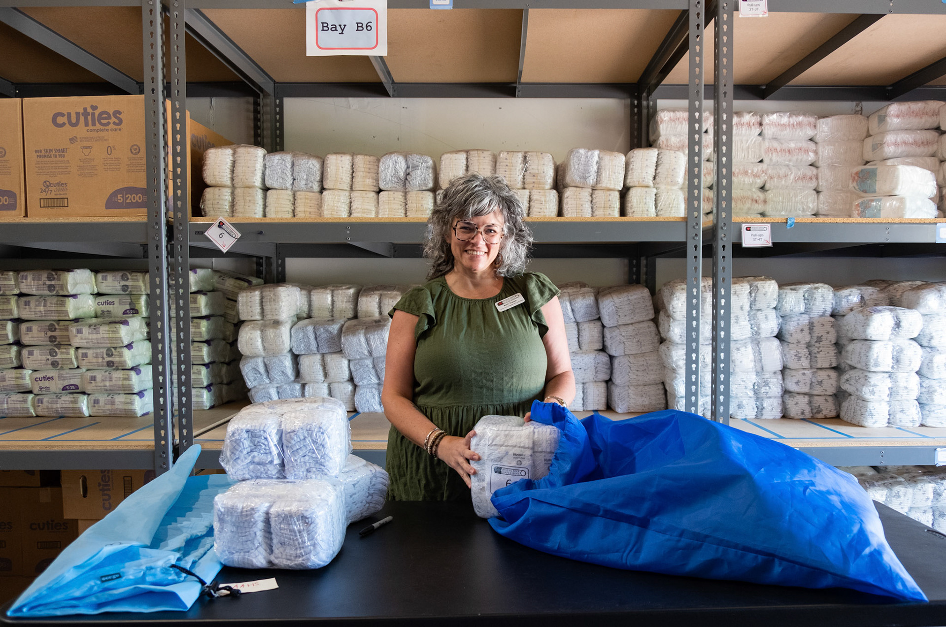 Beth Staton poses for a photo in the warehouse at the Athens Area Diaper Bank headquaters on Friday, April 19, 2024. (Photo/Evan Frilingos; @frilingos.photos)