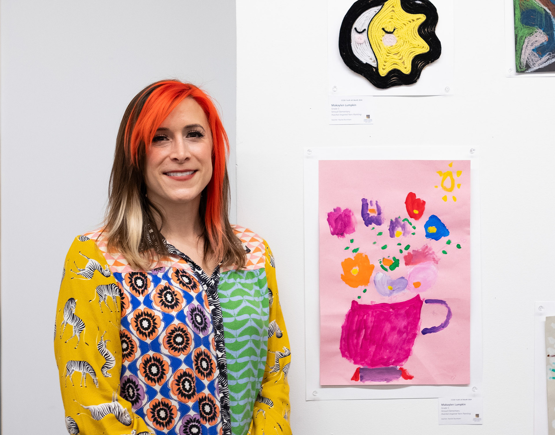 Rachel Burnham, the art teacher at Howard B. Stroud Elemntary School, poses at the CCSD Youth Art Exhibition at the Lamar Dodd School of Art in Athens, Georgia on Sunday, March 24, 2024. (Photo/Evan Frilingos; @frilingos.photos)