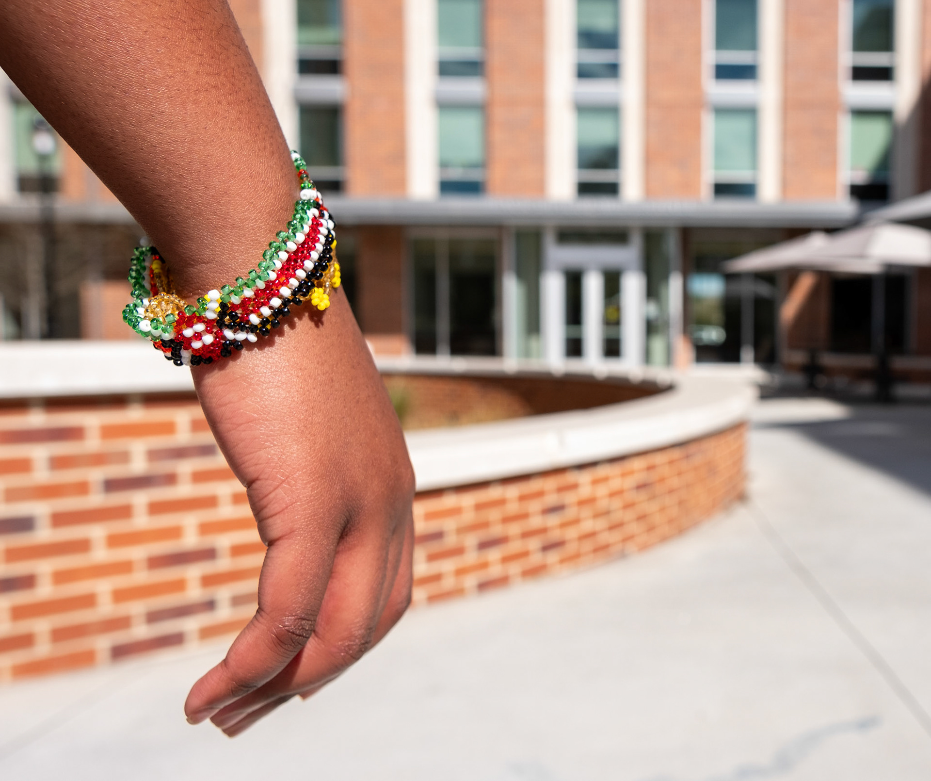 A University of Georgia freshman poses in front of Black Diallo Miller Hall in Athens, Georgia on Saturday, March 23, 2024. (Photo/Evan Frilingos; @frilingos.photos)