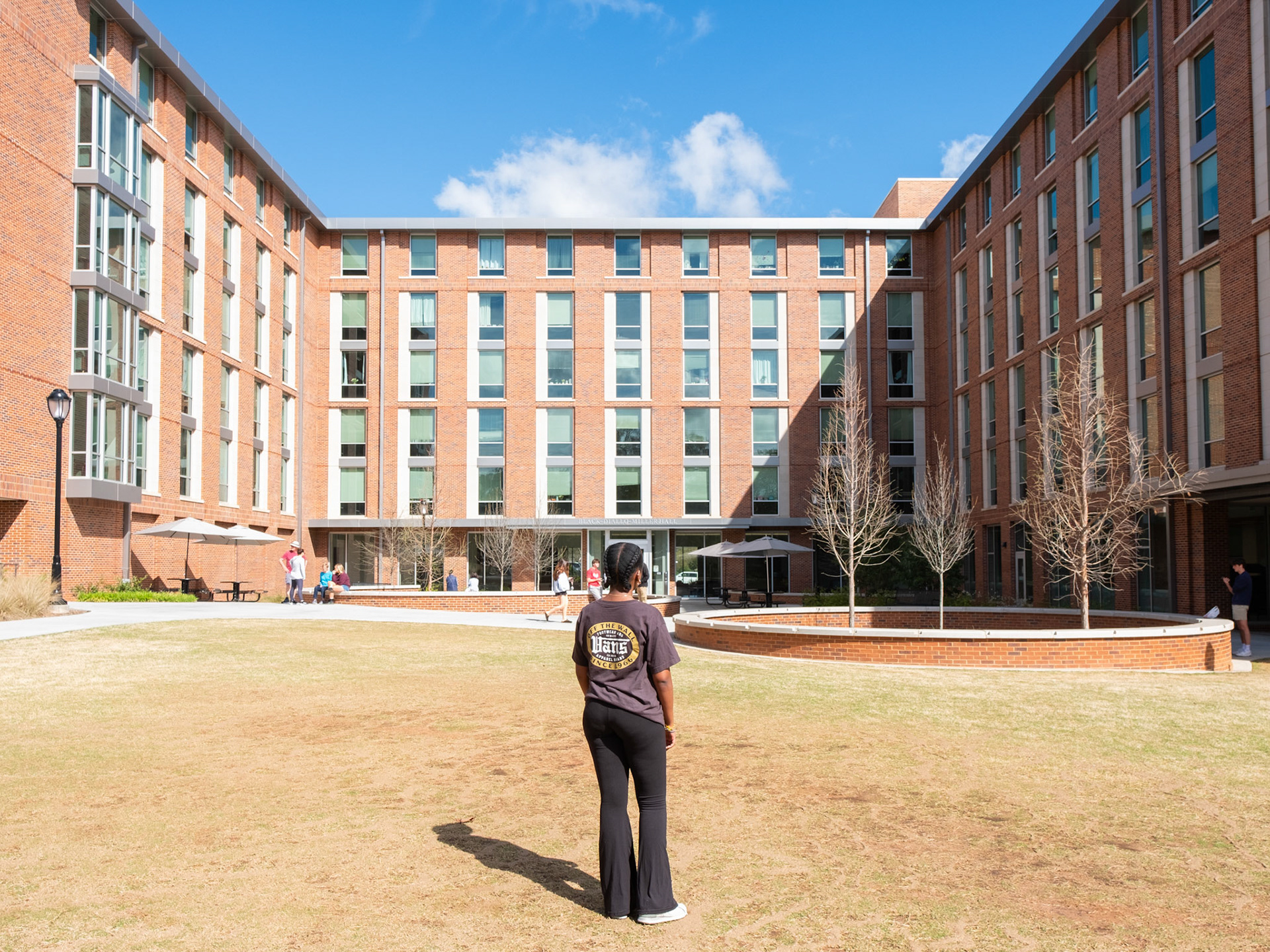 A University of Georgia freshman poses in front of Black Diallo Miller Hall in Athens, Georgia on Saturday, March 23, 2024. (Photo/Evan Frilingos; @frilingos.photos)
