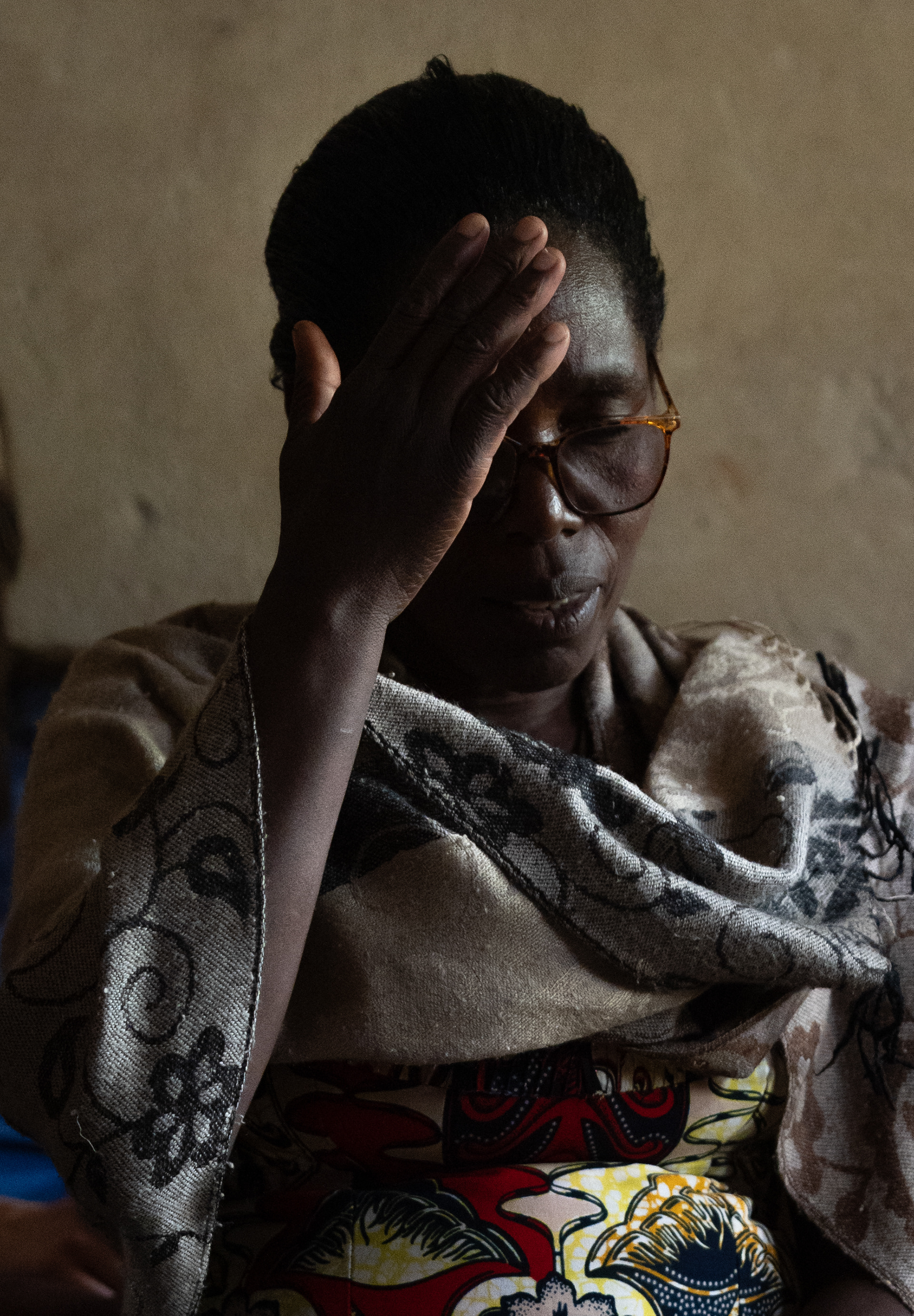 Flortine prays in a rural home on Sunday, May 24, 2026 in Karama, Rwanda. Over 90% of Rwandans are Christian, according to the Association of Religion Data Archives.  (Photo/Evan Frilingos 2026)
