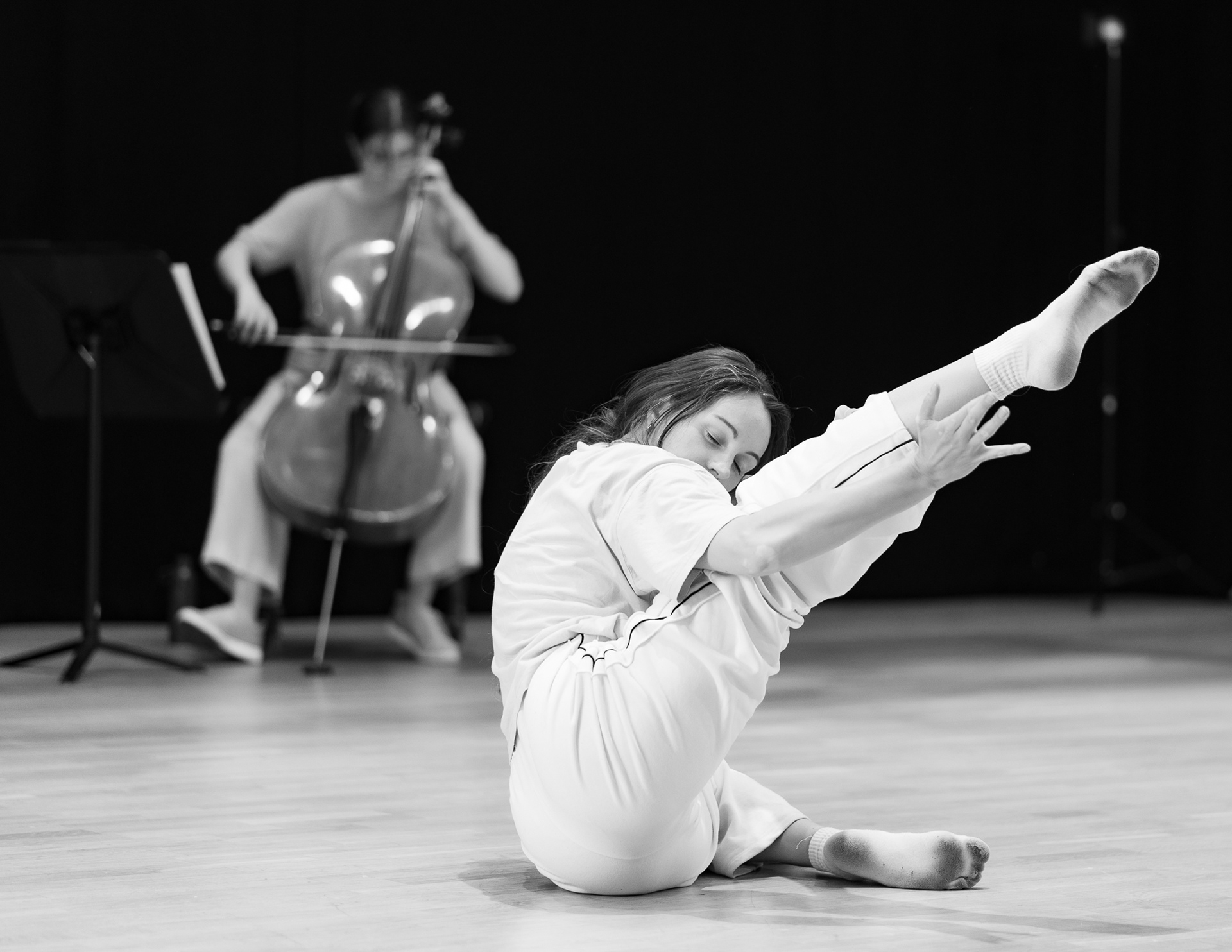 Dancer performs in front of musician