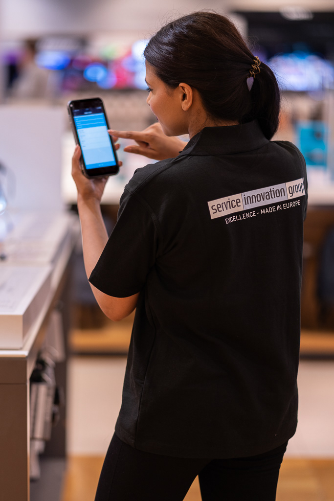 image employee carrying out merchandising role