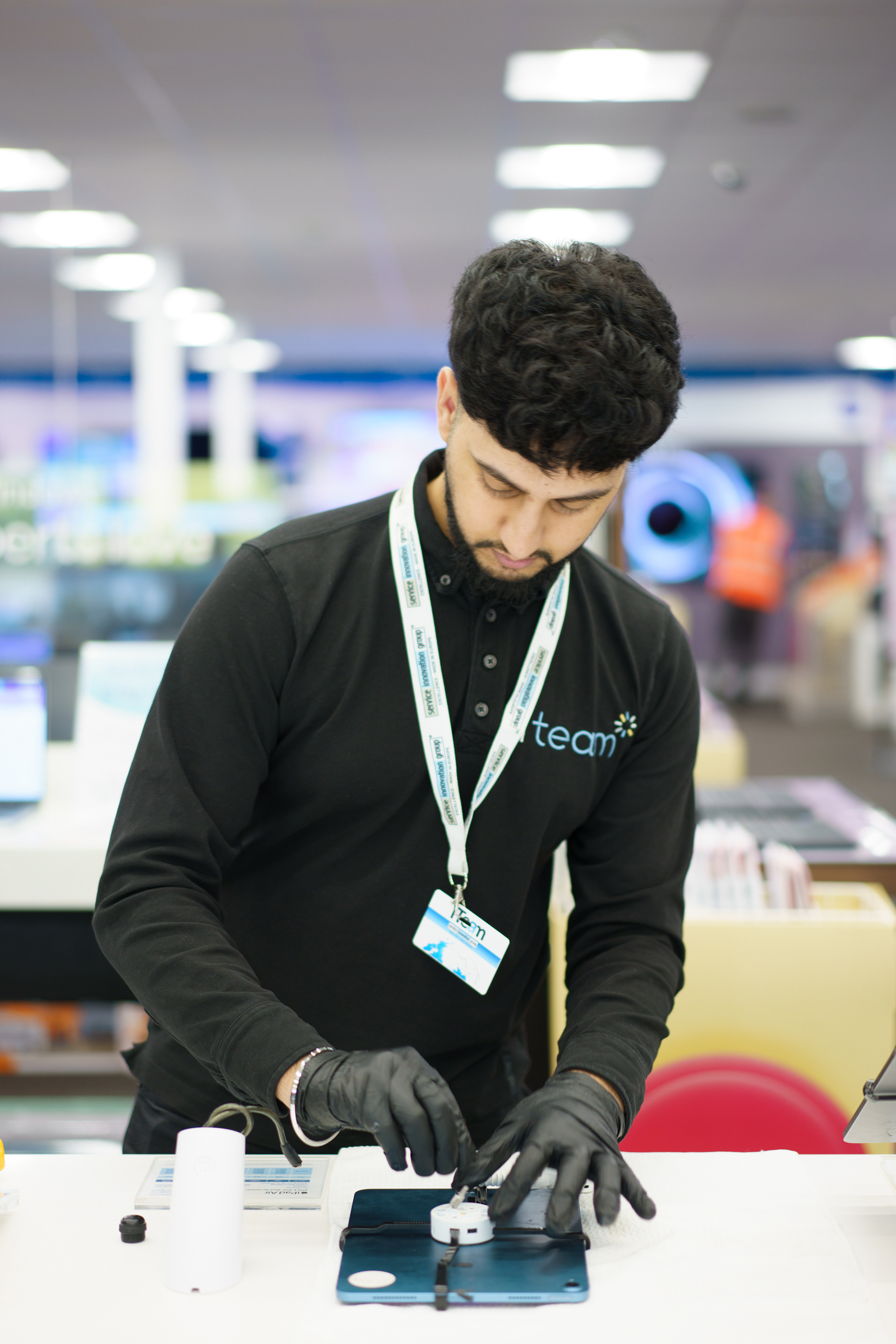 image of retail employee carrying out merchandising activity
