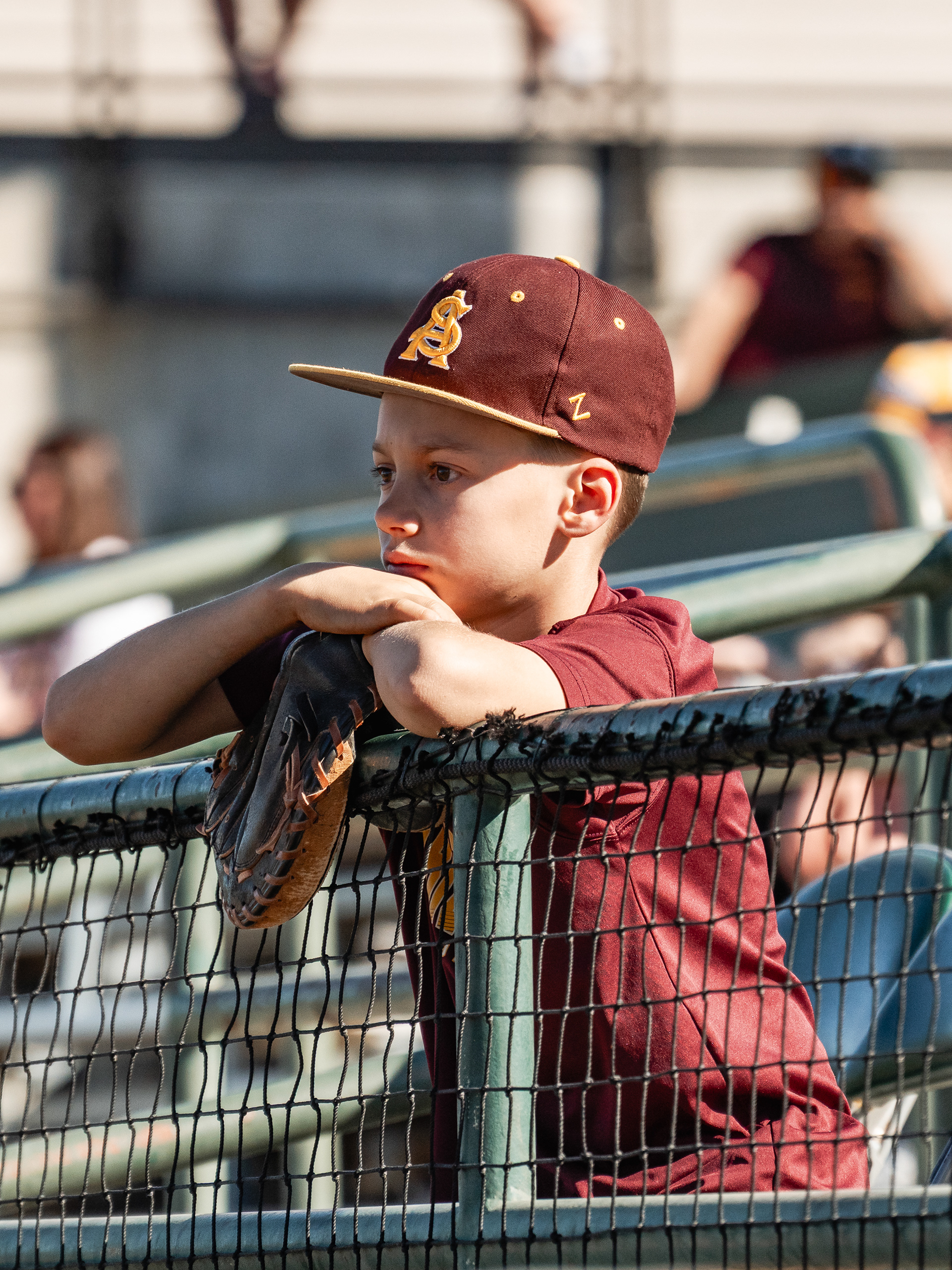  A young Arizona State University baseball fan watches the Sun Devils during a home game against St. John’s University at Phoenix Municipal Stadium on Sunday, February 22, 2026 in Phoenix, Arizona. 
