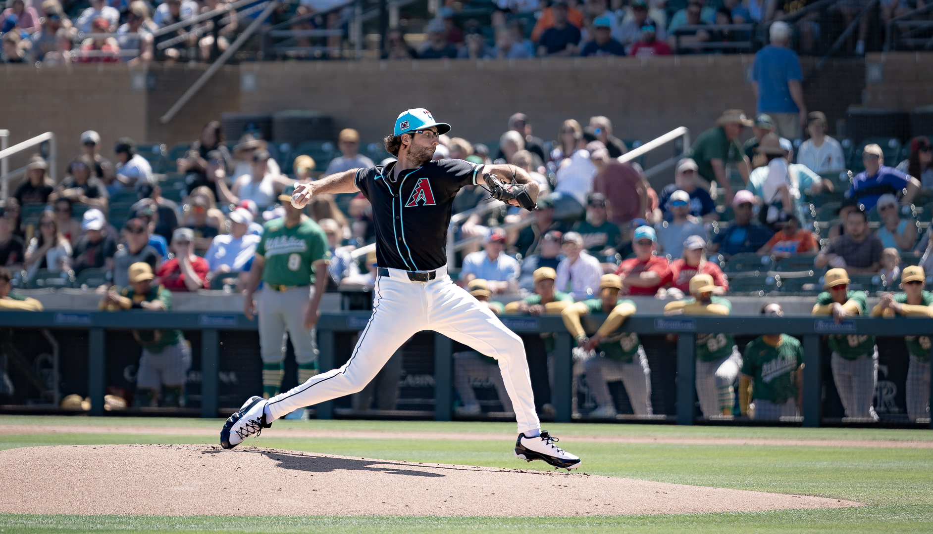 Zac Gallen, Arizona Diamondbacks pitcher, pitches the ball home during a home Cactus League game against the Athletics at Salt River Fields at Talking Stick on Thursday, March 20, 2025 in Scottsdale, Arizona.