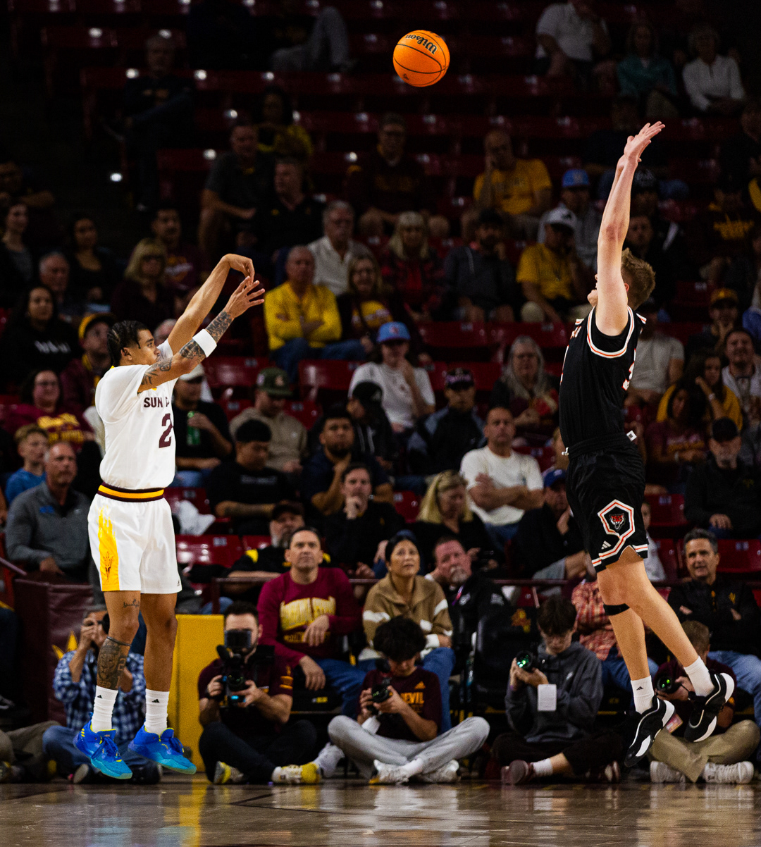 Austin Nunez, Arizona State University guard, shots a corner three pointer over a Idaho State defender at Desert Financial Arena on Tuesday, November 5, 2024 in Tempe, Arizona. 