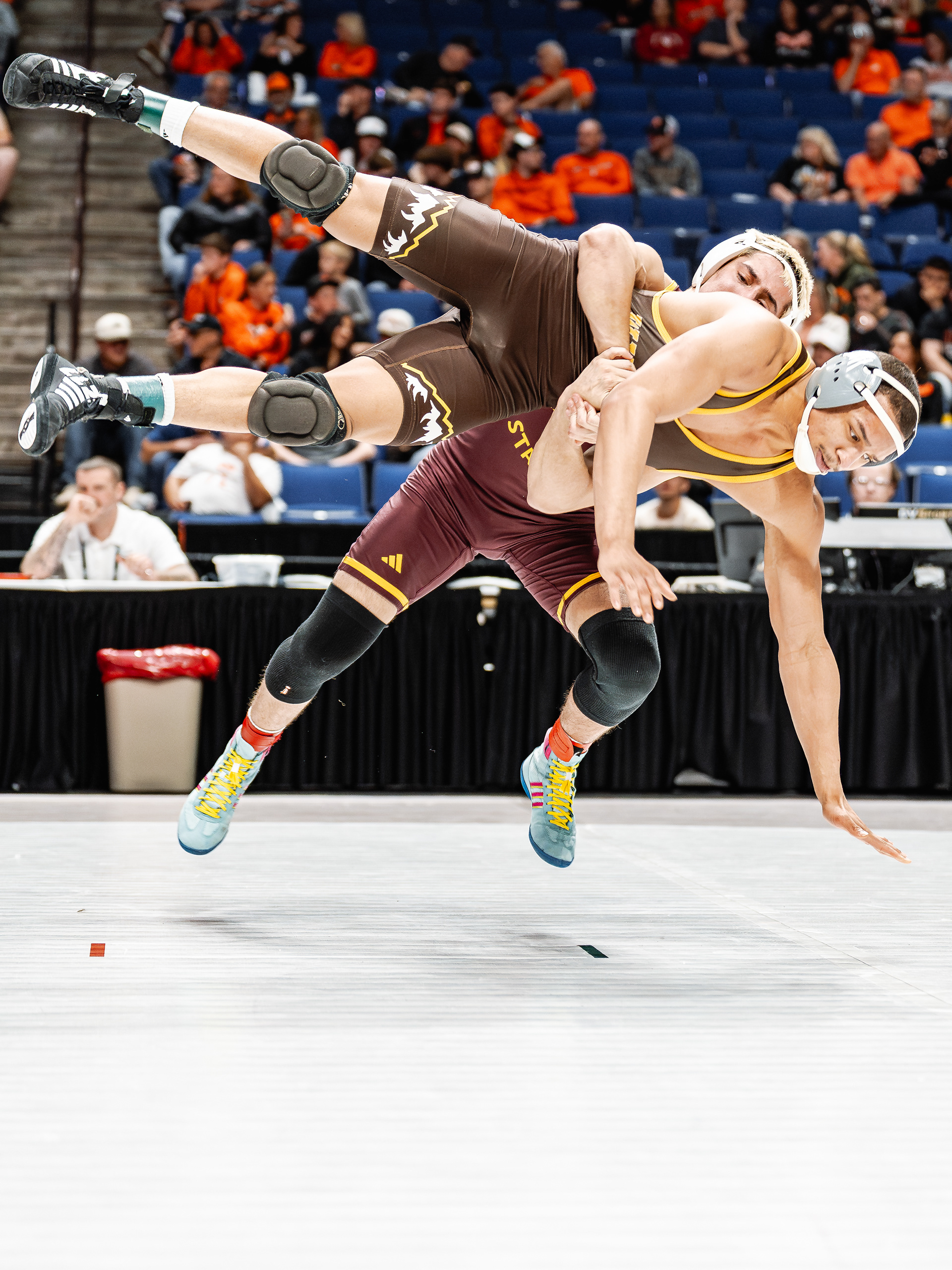 Kaleb Larkin, Arizona State University wrestler, slams Jared Hill, University of Wyoming wrestler, to the mat during the Big 12 Championships at the BOK Center on Friday, March 6, 2026 in Tulsa, Oklahoma. 