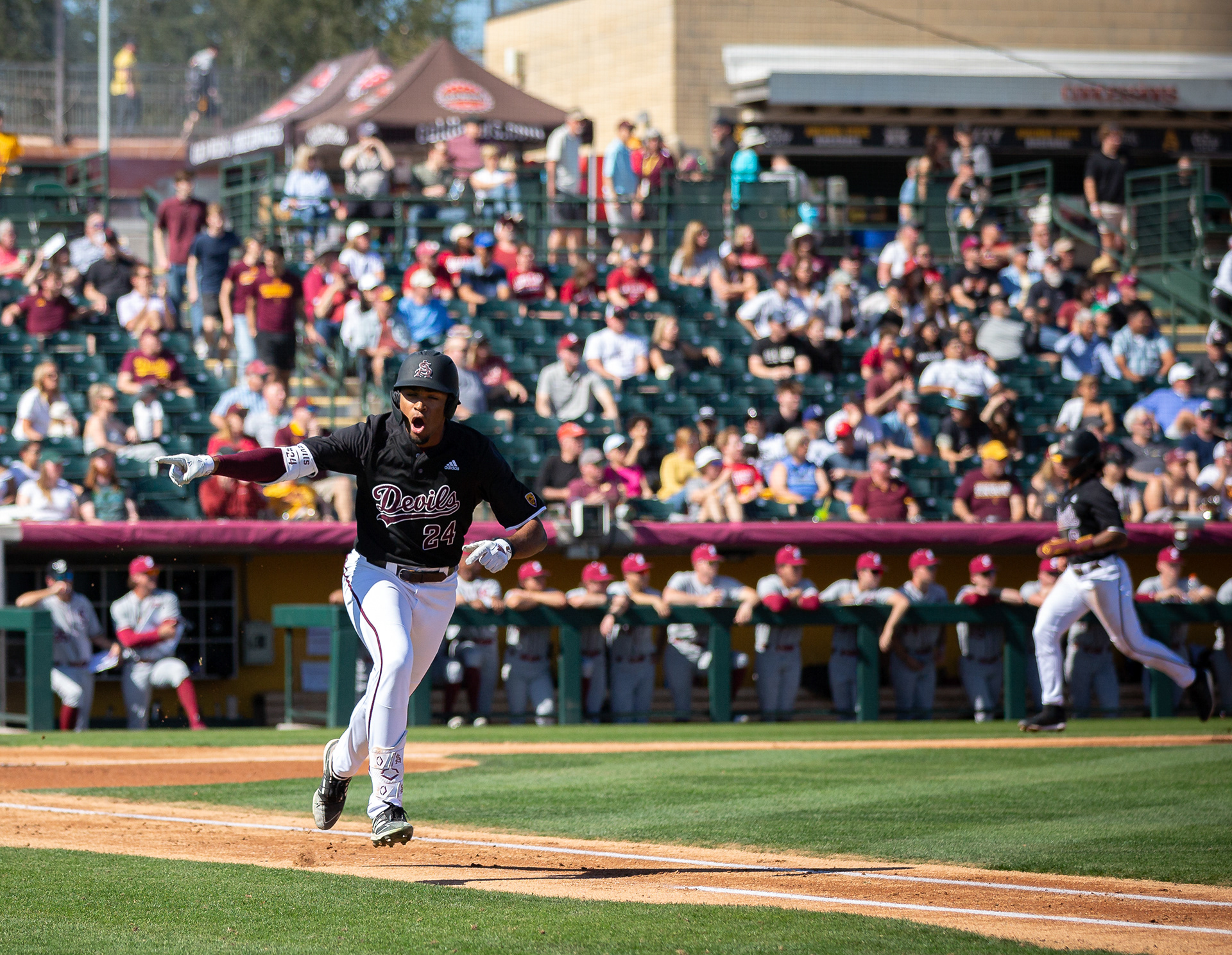  Isaiah Jackson, Arizona State University outfielder, points and yells towards his dugout after hitting a homerun at Phoenix Municipal Stadium on Saturday, February 17, 2024 in Phoenix, Arizona. 