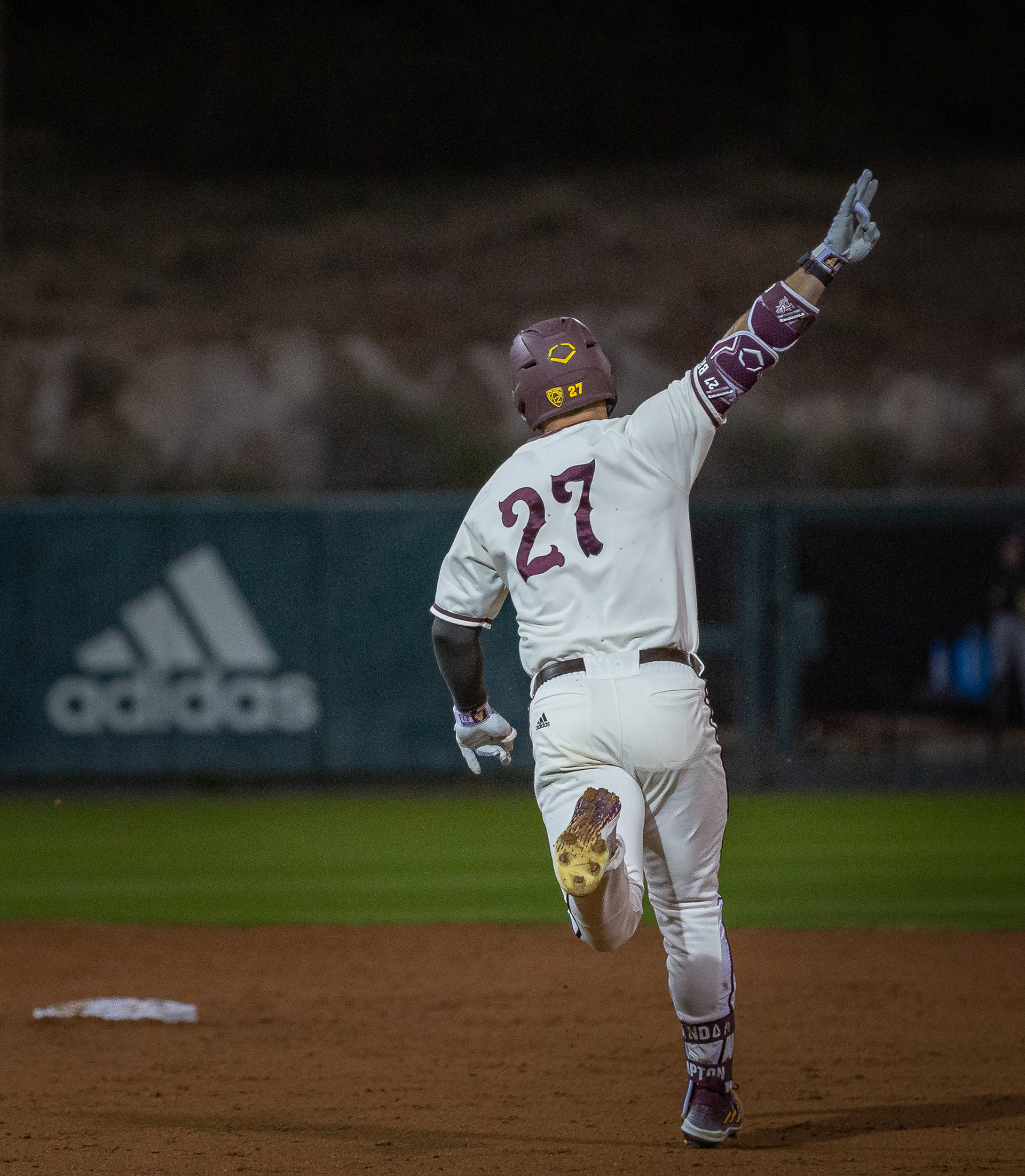 Brandon Compton, Arizona State University outfielder, gives the “forks up” after hitting a home run against Santa Clara University at Phoenix Municipal Stadium on Sunday, February 25, 2024 in Phoenix, Arizona. 