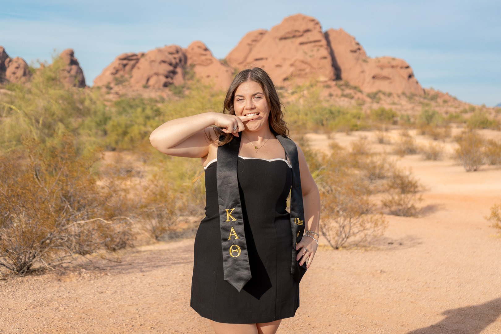  Kaitlyn Wolfe, Arizona State University graduate, does the Theta sign at Papago Park in Phoenix, Arizona