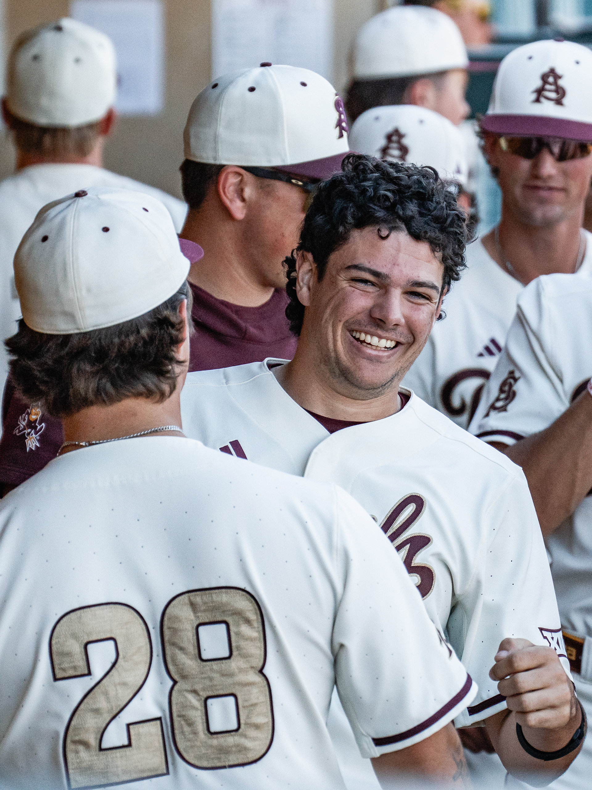 Cooper Clouser, Arizona State University catcher, smiles in the dugout after coming into score during a home game against St. John’s University at Phoenix Municipal Stadium on Sunday, February 22, 2026 in Phoenix, Arizona. 