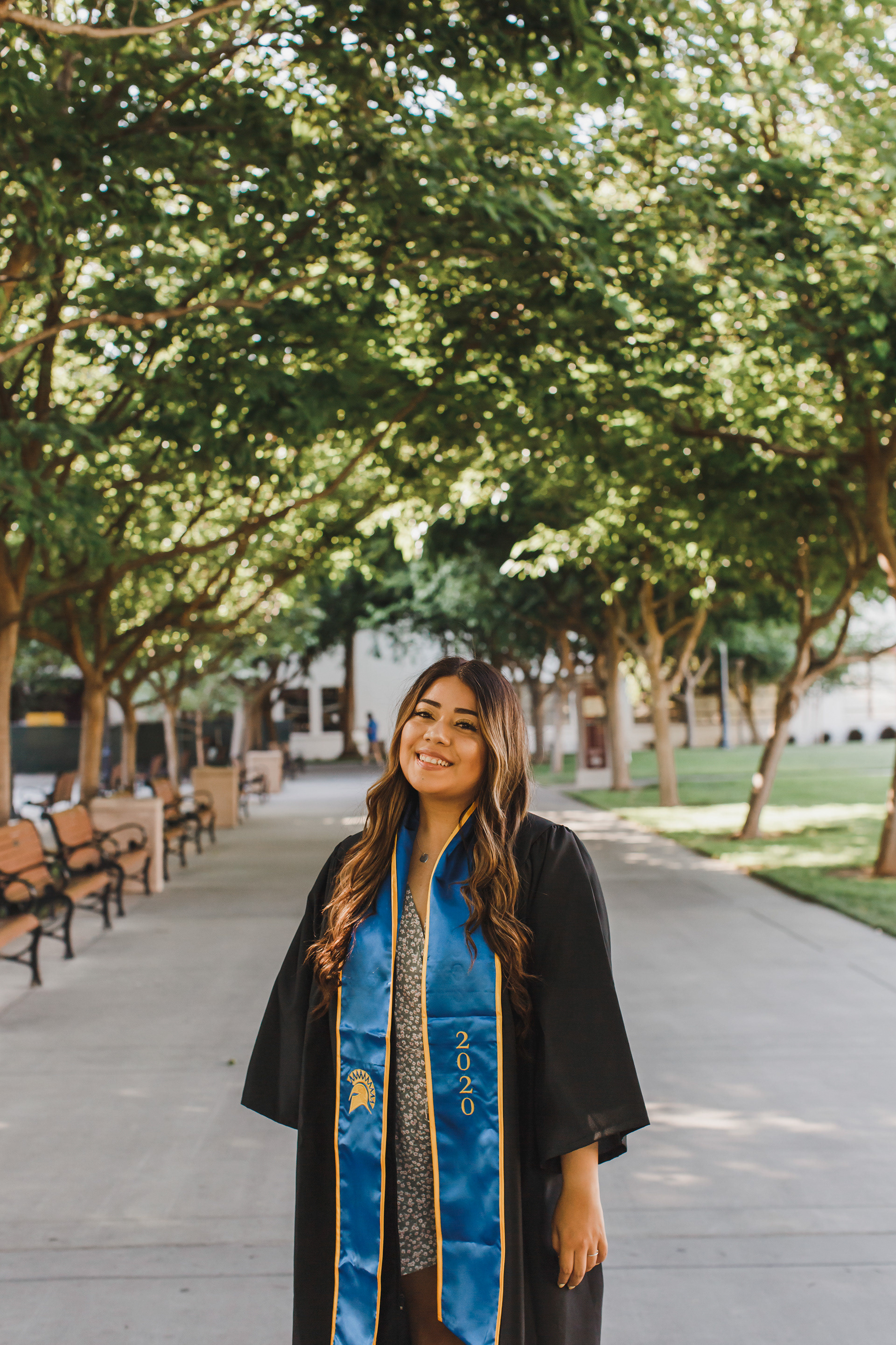 San Jose State University graduate poses with her gown at San Jose State University in San Jose, California. 
