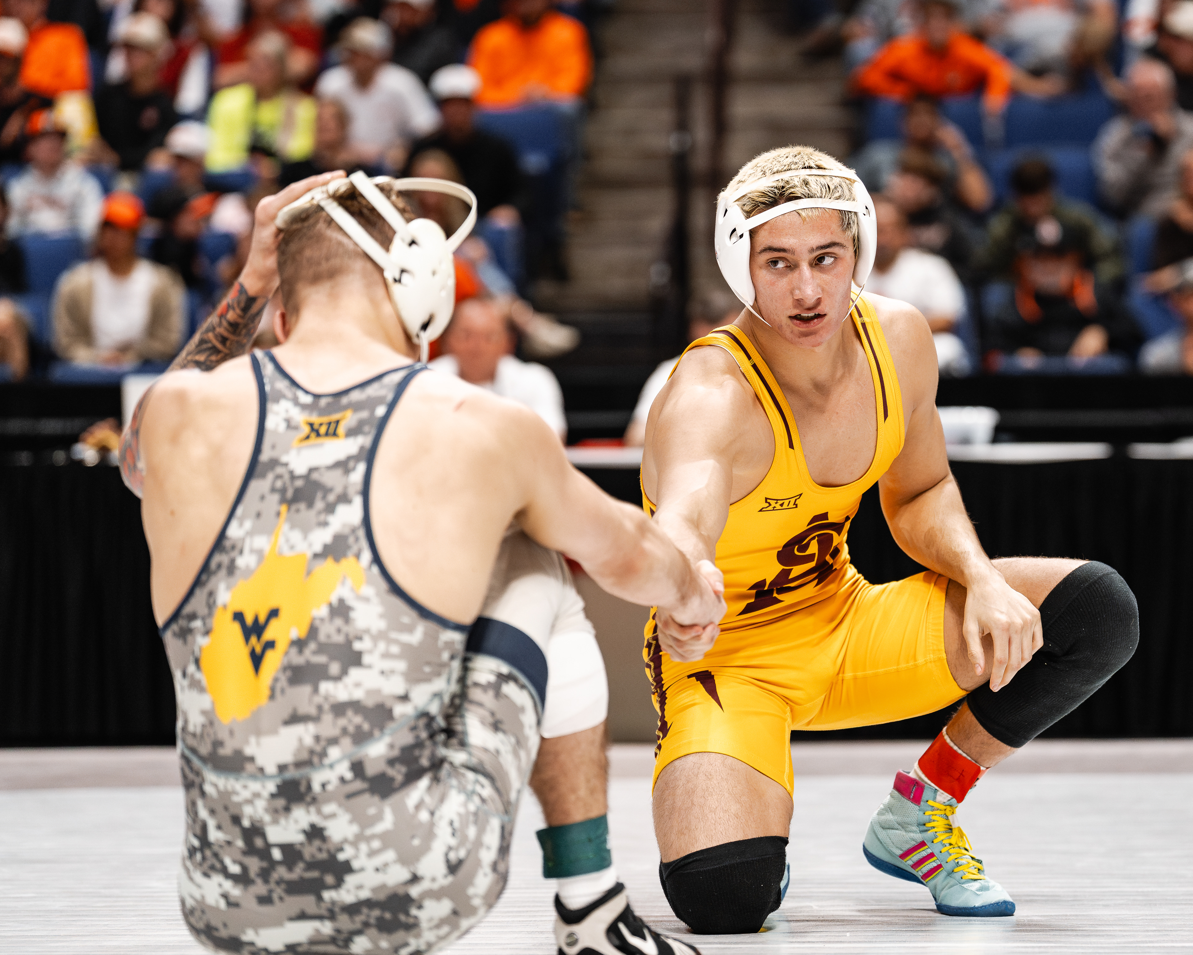 Kaleb Larkin, Arizona State University wrestler, shakes the hand of Ty Watters, West Virginia University wrestler, after their match during the Big 12 Championships at the BOK Center on Friday, March 6, 2026 in Tulsa, Oklahoma. 