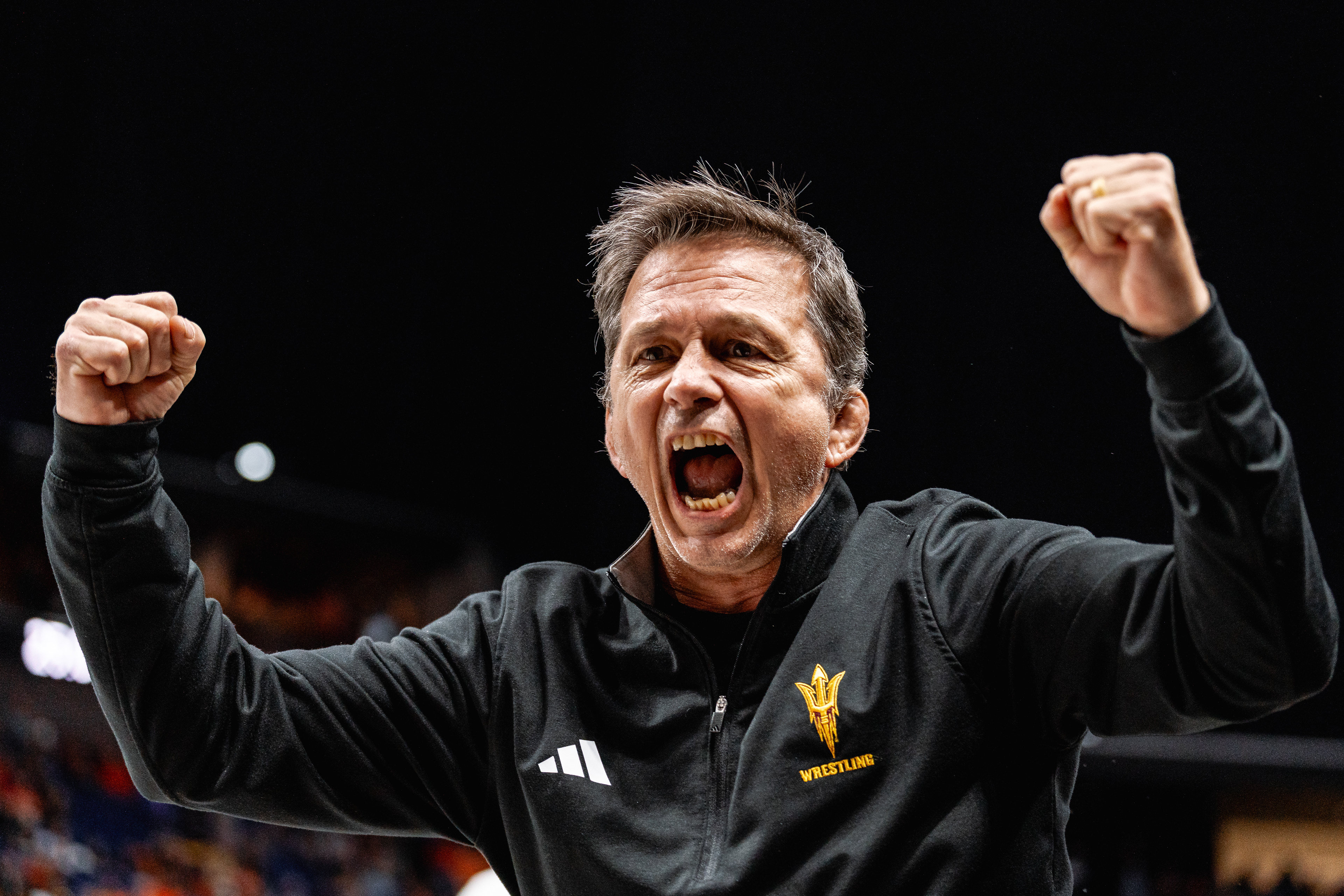 Zeke Jones, Arizona State University wrestling head coach, screams in excitement after wrestler Nicco Ruiz wins a hard fought match during the Big 12 Championships at the BOK Center on Friday, March 6, 2026 in Tulsa, Oklahoma. 