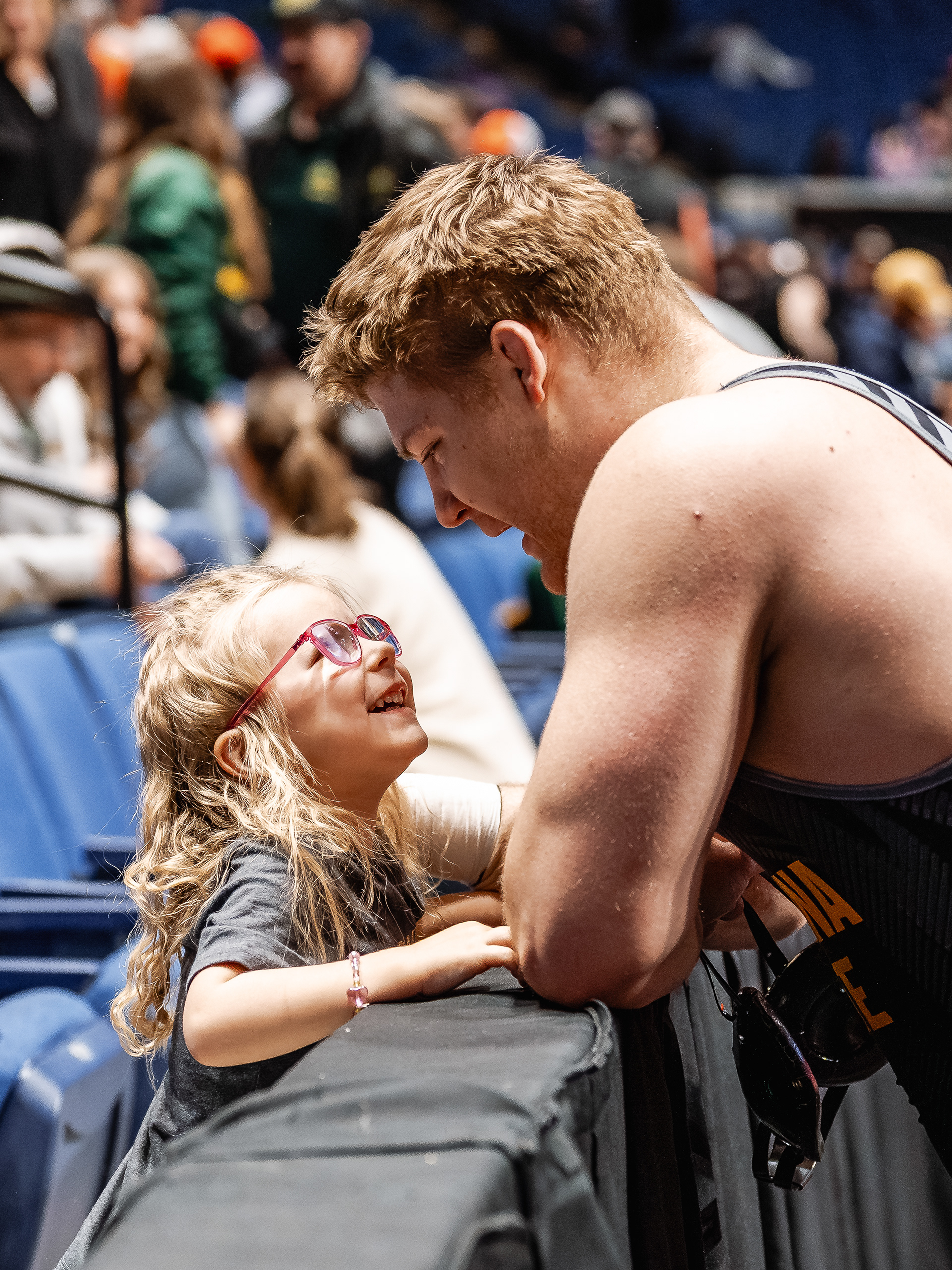 David Szuba, Arizona State University wrestler, shares a moment with his daughter after placing 3rd at the Big 12 Championships at the BOK Center on Friday, March 6, 2026 in Tulsa, Oklahoma. 