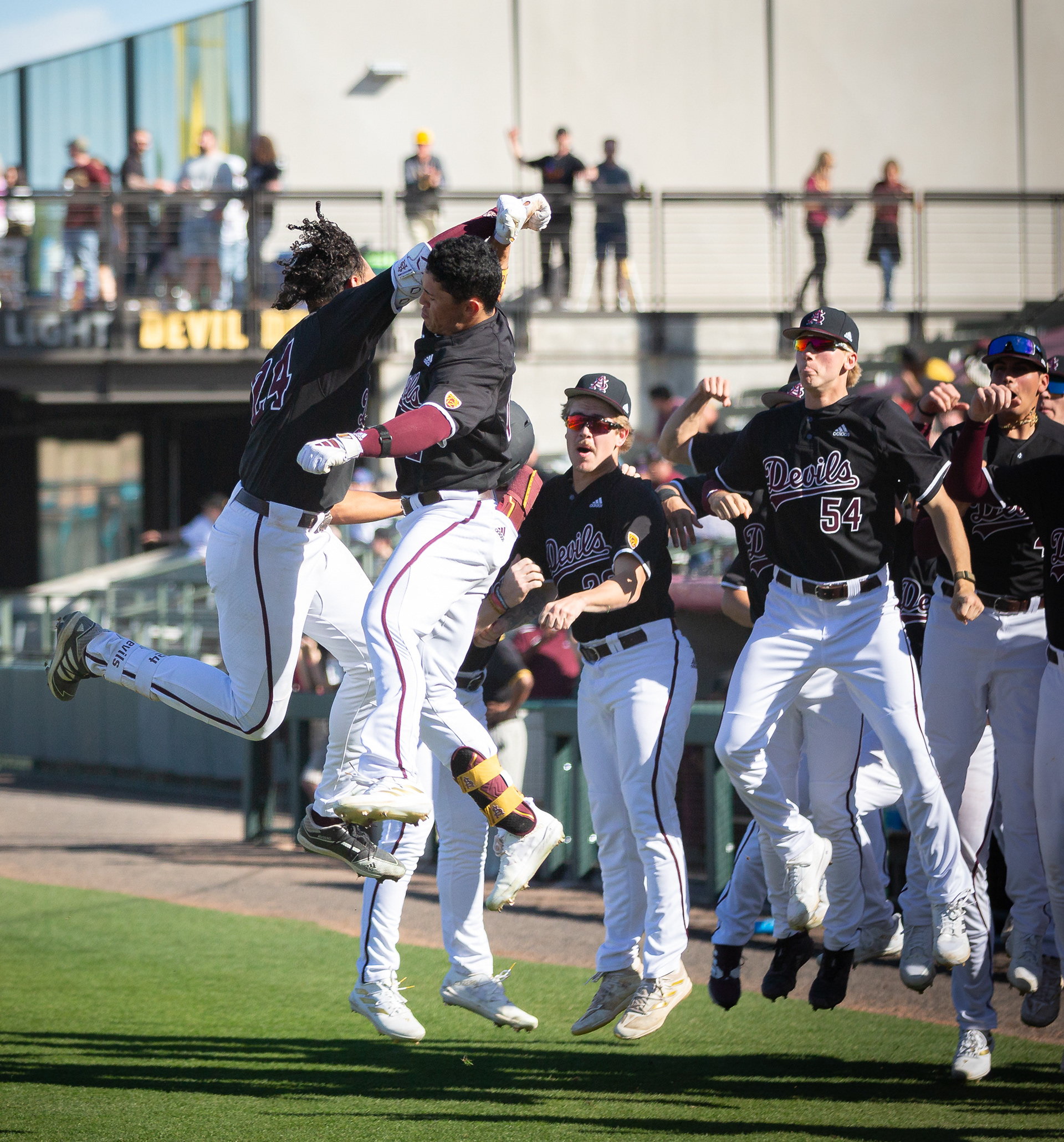 Isaiah Jackson, Arizona State University outfielder, celebrates a home run with teammate Harris Wiliams at Phoenix Municipal Stadium on Saturday, February 17, 2024 in Phoenix, Arizona. 